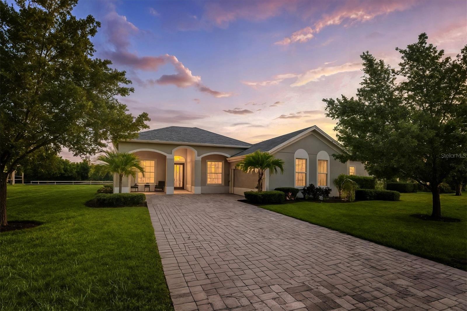 You'll love this thoughtfully designed 3-bedroom home with 2.5 baths, plus a flexible den/office! This layout just makes sense. The spacious gourmet kitchen is a standout. It features a center island, striking tile backsplash, wall oven, and a built-in bar area perfect for easy entertaining. Throughout the home, you'll find elegant tile flooring, impact windows accented with Bahama shutters, and a beautiful tray ceiling that adds a touch of architectural interest. The oversized en suite is a dream, offering two separate vanities and one of the largest showers you'll see - with dual shower heads and generous space. A nearly 50-foot wide, the covered and screened lanai extends your living area outdoors. Enjoy the perks of a community pool and fitness center while living in a home that feels both elevated and easy.