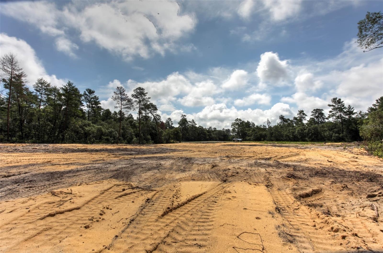 Rare RPUD-Zoned Development Opportunity – 1.36 Acres Cleared & Site Prepped Don’t miss this rare opportunity to develop a high-density project in one of Marion County’s fastest-growing areas. This 1.36-acre parcel is fully cleared, graded, and site-prepped, zoned RPUD and approved for up to 30 residential units. Located just off Marion Oaks Blvd, the property offers excellent visibility and access for a future multifamily, townhouse, or build-to-rent development. Site plans are available for 14 single-story units, giving developers a strong starting point toward permitting. Utilities are nearby, and an upcoming infrastructure project will bring water and sewer down Marion Oaks Blvd, significantly reducing expected connection costs (buyer to verify details with county). For smaller projects, 11 units or fewer only require water hookup; 12 or more will require sewer as well. This parcel is ideal for investors seeking a shovel-ready opportunity in a rapidly expanding corridor. Owner is a licensed real estate agent in the state of Florida.