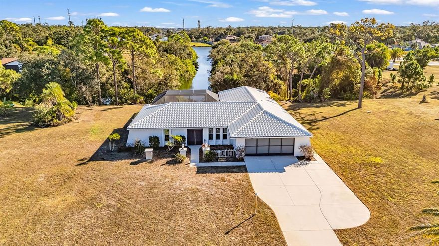 Welcome to 2421 Belle Rd, a spacious split-floorplan •POOL HOME• with just over 2,200 square feet of living space, three bedrooms, two bathrooms, and a two-car garage. This home is located in Dale Lake Estates, a community with •NO HOA FEES• of well-kept homes on large parcels of land all located on a •FRESHWATER CANAL• that leads to a larger lake, perfect for kayaking or fishing! Some of the great features in this home include all the natural light from the large windows and sliding glass doors, two large living rooms, Leaf Filter gutter protection with a lifetime warranty, and a large screen-in lanai with pavers and sparkling pool with an lengthy canal view! You will be wowed with the location of this phenomenal home, not only do you get privacy in the back with the woods and canal, but across from the front of the home you will find the Manasota Scrub Preserve, a 174 acre preserve with hiking trails and lots of wildlife including Gopher Tortoises, Norther Quails, and Great-Horned Owls! If you are looking for privacy, with close proximity to everything Englewood has to offer, this home might be exactly what you are looking for! Call your favorite real estate agent to schedule your own private tour of this wonderful home! Don’t forget to look at the available FLOORPLAN & 3D VIRTUAL TOUR to get a great idea of the home layout before you even arrive! Welcome home!