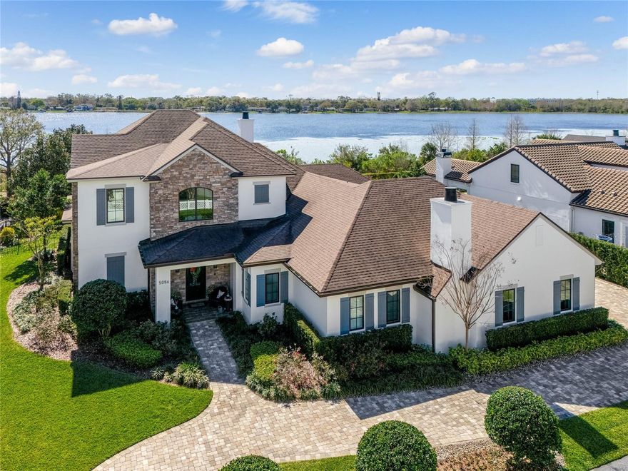 Lakefront luxury at its finest on one of Baldwin Park’s largest lots! Start living your dream with this elegant, custom-built, lake-view home in Baldwin Park. As you enter the home you will be amazed at the large, open floor plan that allows breathtaking views of the backyard oasis and Lake Susannah from almost every vantage point.  The first-floor owner’s retreat offers a serene escape with a cozy fireplace and unobstructed views of sunrises over the lake. The private ensuite and massive walk-in custom closet complete the owner’s retreat. The first floor also has two secondary bedrooms, each with a walk-in closet and ensuite bathrooms. The two secondary bedrooms enter a shared common area, which can be used as a retreat for the younger generations, homework area, game room, or movie theater.  The massive great room, with sliding doors that open to the backyard oasis, blends seamlessly into the gourmet kitchen. If you can take your eyes off the mesmerizing Van Gogh Granite Island, you will notice elite custom kitchen cabinetry, a large back kitchen/pantry, a wet bar with double drawer mini fridge as well as a wine fridge, perfect for entertaining. The private home office is tucked away and allows for the perfect setting for work calls and virtual meetings.  A custom-tiled powder room, a pool bath, and a first-floor laundry room complete the downstairs living space. Elevate your living to the second floor by ascending the beautiful staircase, or take a ride on the in-home elevator, located just off the foyer. Upstairs you will find a cozy sitting area, perfect for reading a book and gazing out the large picture window.  An AuPair’s suite with a private ensuite bathroom and walk-in closet greets you at the top of the stairs. A large upstairs secondary master with his/her closets and ensuite with a large walk-in shower and soaking tub complete the five total bedrooms of this amazing home.  In addition to the 3 walk-in closets upstairs, there is also a linen closet and a huge storage room, perfect for Christmas decorations, suitcases, and any other in-home storage needs. Outside is a true paradise, with a large custom pool and spa, travertine stone pavers, two outdoor living spaces complete with a warm and inviting fireplace, and an outdoor kitchen that will meet all your grilling needs.  The backyard extends to a large green space, perfect for your four-legged friends, and just steps from the Cady Way Trail. Beyond the pool oasis, you will find a large backyard with tons of space for activities as well as turf to perfect your putting game. Located on a large corner lot, there is plenty of parking from your extended driveway, off-street parking on your circle drive, and an oversized three-car garage complete with 3 electric car charging circuits. Just a short stroll from your front door you will find the heart of Baldwin Park town center, with shopping, high-end dining experiences, miles of trails, parks, green spaces, community pools, and fitness centers. Want to try something new? You are just minutes from Park Ave in Winter Park where restaurants and boutique shops line the brick-lined streets, Audubon Park where trendy cafés and shops are moments away, Downtown Orlando where you will find entertainment galore, and only 45 minutes to the beach! What more could you want? Zoned for A-rated Baldwin Park Elementary, Glenridge Middle School, and Winter Park High School, this home has the best of everything Orlando has to offer. Bedroom Closet Type: Walk-in Closet (Bedroom 4).