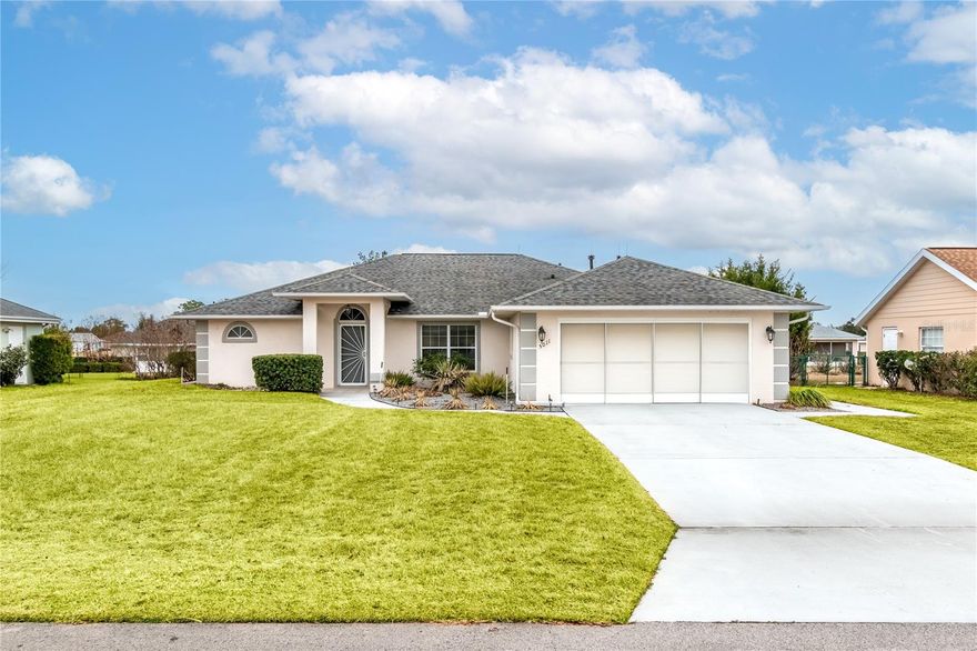 A homeowner’s dream come true! Fall in love with this inviting custom-built, move-in ready home nestled within Quail Meadow, a charming 55+ community with an excellent location close to everything. This special home combines flexible living space, quality upgrades, and a prime setting, all ready for its next owner to enjoy! Residents enjoy daily walks through the community, access to a clubhouse, swimming or lounging by the sparkling pool, and a variety of other neighborhood activities and social opportunities! From the moment you arrive, the well-maintained exterior welcomes you with a newer shingle roof (2018), mature landscaping supported by a private irrigation well, lightning rods, and attached oversized, privacy screened two-car garage. This upgraded 3-bedroom, 2-bath home offers not only just under 1,900 sqft of thoughtfully designed space, but an additional 240-square-foot glass-enclosed rear lanai that provides an exceptional multi-purpose space, giving you over 2,100 sq ft that you can enjoy year-round. As you enter the welcoming foyer, a beautiful set of glass French doors to the right opens to a versatile flex room ideal for use as a home office, den, or hobby space. Vaulted ceilings with skylights and large viewing windows allow abundant natural light to stream through into the living room and kitchen, bringing nature into the home as a feature. Lighted ceiling fans and vinyl plank and tile flooring throughout the main living spaces add warmth to the home. The spacious kitchen is designed for both everyday living and entertaining, featuring granite countertops, Wellborn Deluxe Maple soft-close cabinetry, under-cabinet lighting, pantry storage, 5-burner gas stove, a newer stainless steel built-in microwave and refrigerator and a breakfast bar that provides casual seating. The adjacent dining area flows seamlessly to the glass-enclosed lanai. Designed with a split-bedroom floor plan for enhanced privacy, each bedroom is generously sized and finished with newer carpeting. The primary suite includes dual closets, private en-suite with step-in shower, and direct access to the glass-enclosed rear lanai, creating the perfect private retreat. An additional open concrete patio with privacy hedging extends your outdoor enjoyment, perfect for grilling and relaxing. A dedicated indoor laundry room adds convenience with washer, gas dryer, utility sink, and overhead cabinetry. The garage offers lighted ceiling fans, a side service door, overhead storage with pull-down stairs, and generous space for vehicles and storage. Major systems have been thoughtfully updated, including a 4-ton, 19 SEER Lennox gas HVAC system (2020), gas water heater, and a water softener system for added comfort and efficiency. Situated within walking distance to Publix, Walgreens, banks, restaurants and more, this property has a truly exceptional location. UF Health’s new hospital and I-75 are located just 2 miles away, while the World Equestrian Center (WEC) is just a short drive away for year-round spectating options.