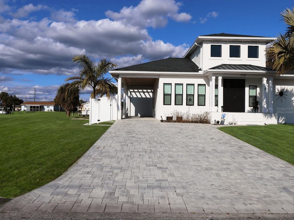 Photo of 112 Leland Street SE, Port Charlotte, FL 33952 (MLS # C7520723)