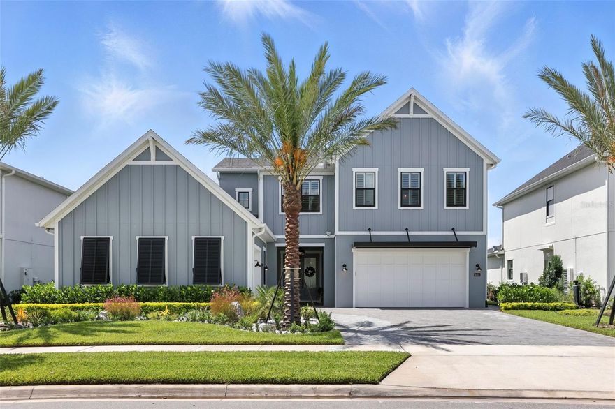 Your Dream Home Awaits in Laurel Pointe!
Discover this custom-built 2024 masterpiece in the exclusive gated community of Laurel Pointe at Lake Nona. This 4-bedroom, 4.5-bath home offers over 4,400 square feet of thoughtfully designed living space, blending high-end finishes with everyday comfort.

The modern farmhouse exterior showcases clean architectural lines and a welcoming front elevation. The professionally designed front yard is accented by lush greenery, manicured shrubs, and striking palm trees that add a touch of tropical elegance. A wide paver driveway leads to a three-car split garage, featuring sleek glass-panel doors and a climate-controlled bay—fully finished and currently set up as a golf simulator, complete with epoxy floors and finished walls.

Inside, a grand double-door entry opens to a dramatic foyer with a statement chandelier. The great room impresses with wood beam-accented ceilings, a floor-to-ceiling stone feature wall, and custom lighting throughout. Luxury wide-plank flooring and designer finishes add warmth and elegance in every room.

The chef’s kitchen features quartz countertops, extended soft-close cabinetry, a premium built-in refrigerator, and top-tier appliances. A spacious island flows into a sunlit dining area overlooking the pool and pond.

The thoughtfully designed first floor includes the luxurious primary suite with peaceful water views, a custom herringbone ceiling, spa-style bath with dual rainhead shower, soaking tub, and a fully built-out his and hers custom closet. An additional en suite bedroom is also located on the main level, ideal for guests or multigenerational living, along with a separate office for added convenience.

Upstairs, you’ll find two more en suite bedrooms, a versatile loft, a cozy flex space that can serve as a secondary office or reading nook, and a private media room equipped with a projector—perfect for movie nights.

Step outside to your private resort-style escape. The screened saltwater pool and spa are framed by fire bowls, lush landscaping, and turf inlays. The outdoor kitchen features quartz counters, built-in grill, beverage fridge, sink, and TV. A private putting green completes this entertainer’s dream.

Located just minutes from Lake Nona Medical City, top-rated schools, dining, and the airport, this home offers the perfect blend of luxury, innovation, and lifestyle.

Schedule your private showing today.