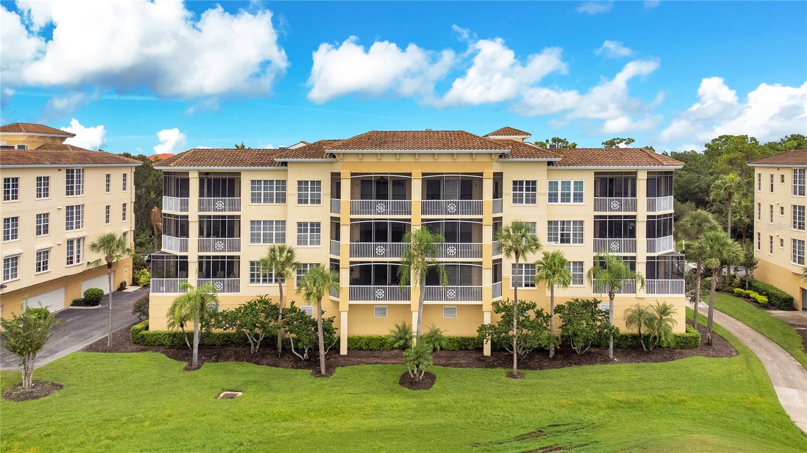 Welcome to Watercrest, an elegant gated lakefront condominium community within Lakewood Ranch’s Edgewater Village. This spacious 3-bedroom, 2-bath, condo is situated on the 13th fairway, offering extended water views and serene golf course vistas. The open floorplan is perfect for both everyday living and entertaining, featuring bright living spaces and refined finishes throughout. Enjoy an additional screened-in balcony space with panoramic views — the ideal spot for morning coffee or evening relaxation. The oversized 2-car garage includes a dedicated workshop area, providing plenty of room for storage and hobbies. Residents of Watercrest enjoy resort-style amenities including a beautifully remodeled clubhouse, heated pool and spa, fitness center, and on-site management. All of this is nestled among lush landscapes, walking trails, and stunning views of Lake Uihlein and the Legacy Golf Course — and just a short walk to Lakewood Ranch Main Street’s shops, dining, and entertainment. Plus, you're only a short drive to the world-famous Gulf Coast beaches. This is the perfect blend of comfort, convenience, and the Florida lifestyle.