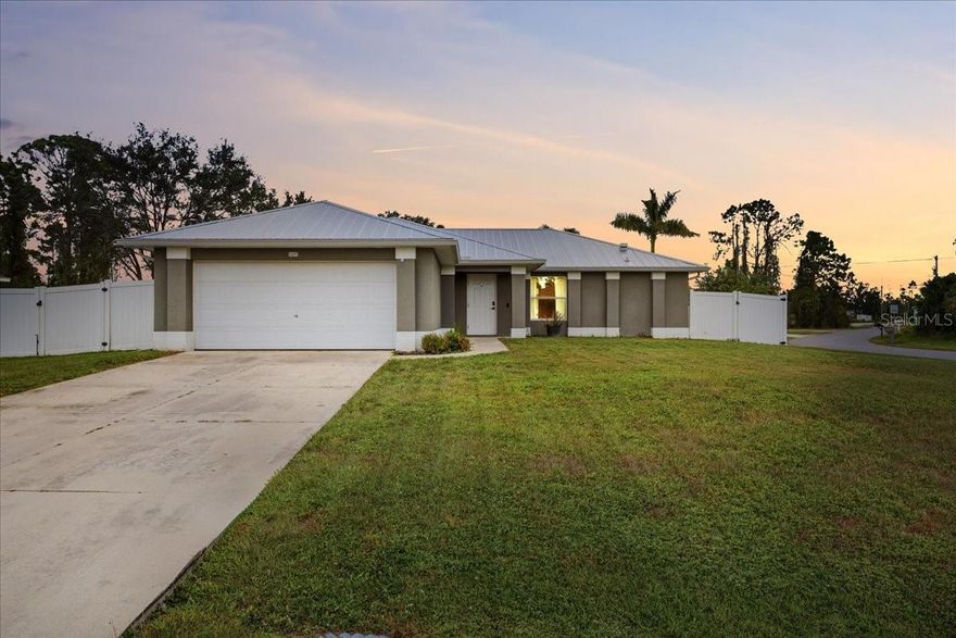 Beautiful and airy 3-bedroom, 2-bath home situated on an oversized, fully fenced corner lot with dual gated entrances one 10 ft and one 5 ft wide perfect for boat or RV parking. This open split floor plan offers vaulted ceilings, abundant natural light, and fresh neutral finishes throughout. The kitchen features a breakfast bar and opens to the dining and living areas, creating a seamless flow ideal for entertaining. The private master suite includes two spacious walk-in closets and an updated master bathroom with dual sinks and a walk-in shower. New flooring enhances the home’s clean, modern feel. Enjoy the screened-in lanai overlooking the large backyard, offering plenty of room to relax or play. Conveniently located near Price Blvd, Toledo Blade, and just minutes from I-75, this property provides an easy commute and quick access to shopping, dining, and all that North Port has to give. A must-see combination of comfort, updates, and location.