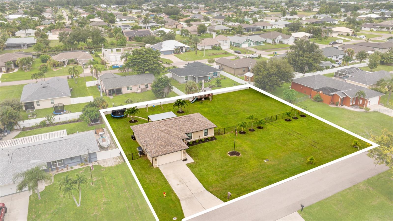 Check out the virtual tour & 3D walkthrough matterport tour! Spacious 3-Bedroom, 2-Bath Home on a HALF ACRE and NOT IN A FLOOD ZONE! Perfect for family living, entertaining & future possibilities! Built in 2019, this thoughtfully designed home combines modern comfort with room to grow. Nestled on a generous half-acre lot, it’s ideal for people seeking space, privacy, and flexibility. Inside, you’ll find an open, light-filled layout perfect for everyday living and entertaining. The laundry room has been upgraded with a convenient pantry—made possible by relocating the AC to the garage—adding extra storage and functionality. Outside, the expansive yard offers endless opportunities: plenty of space for kids and pets to play, hosting gatherings, starting your own homestead, create your dream outdoor retreat or simply enjoying the peace of not being on top of your neighbors. With a lot this size, you can even consider building a second home for family, build onto the current home, build a separate garage for all of your recreational toys, develop the lot for future investments, OR split the lot, sell it, and reap the financial rewards! Location is truly impeccable—this home offers two neighborhood exits onto main connecting roads, making travel a breeze. You’ll enjoy quick access to Pine Island Road and Veterans Parkway, plus you’re just minutes from TOP-RATED SCHOOLS, grocery stores, restaurants, and everyday conveniences. Whether you’re looking to raise a family, entertain, create a homestead, or invest in your future, this property offers the perfect blend of comfort, space, and location. Don't miss out!! WE LOVE BUYER'S AGENTS!! =)