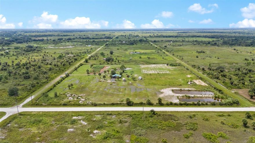Discover this fully operational 10-acre agricultural property in Okeechobee, Florida – ideal for farming, investment, or a private retreat. This property is set up as a working agricultural operation and also provides the perfect foundation for a private retreat or income-producing investment. The land is fully fenced and features a complete underground irrigation system that services every tree on the property. Currently in production are a variety of tropical fruits including papaya, mango, sugar plum, banana, and coconut, offering both personal enjoyment and commercial potential. Adding to the uniqueness of this farm are three stocked fishponds, enhancing both the beauty and versatility of the land. The property also includes a large pole barn, two wells for reliable water access, separate bathroom facilities, and multiple outbuildings including a shed and office, providing plenty of functional space for day-to-day operations. This offering is further enhanced by the inclusion of a Kubota tractor and gas-powered golf cart, making farm management and transportation convenient and efficient. The property also has internet service provided by Hews, allowing you to stay connected while working remotely in a peaceful rural environment. With its established infrastructure, producing fruit trees, and valuable agricultural enhancements, this farm is truly a turnkey opportunity for farmers, investors, or anyone seeking a productive agricultural property in Okeechobee. Don’t miss your chance to own this exceptional 10-acre tropical farm, fully equipped and ready for the next owner to enjoy and expand.