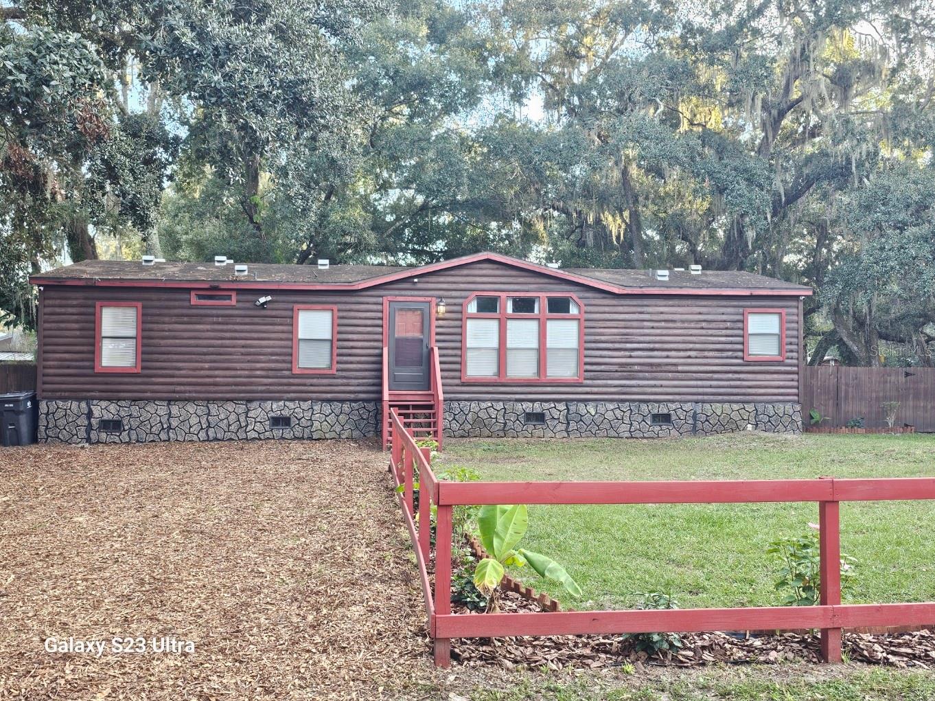 Looking for a little Country Living? Make this cozy Log Cabin Style house your new home. It's rustic Log Cabin style on the outside and modern touch on the inside sitting on just shy of 1/4 acre. This home has 3 bedrooms and 2 bath with approx. 1500 sq. ft., Wood Laminate flooring in the living and dining areas, and carpet in all the bedrooms. Make an appointment today.