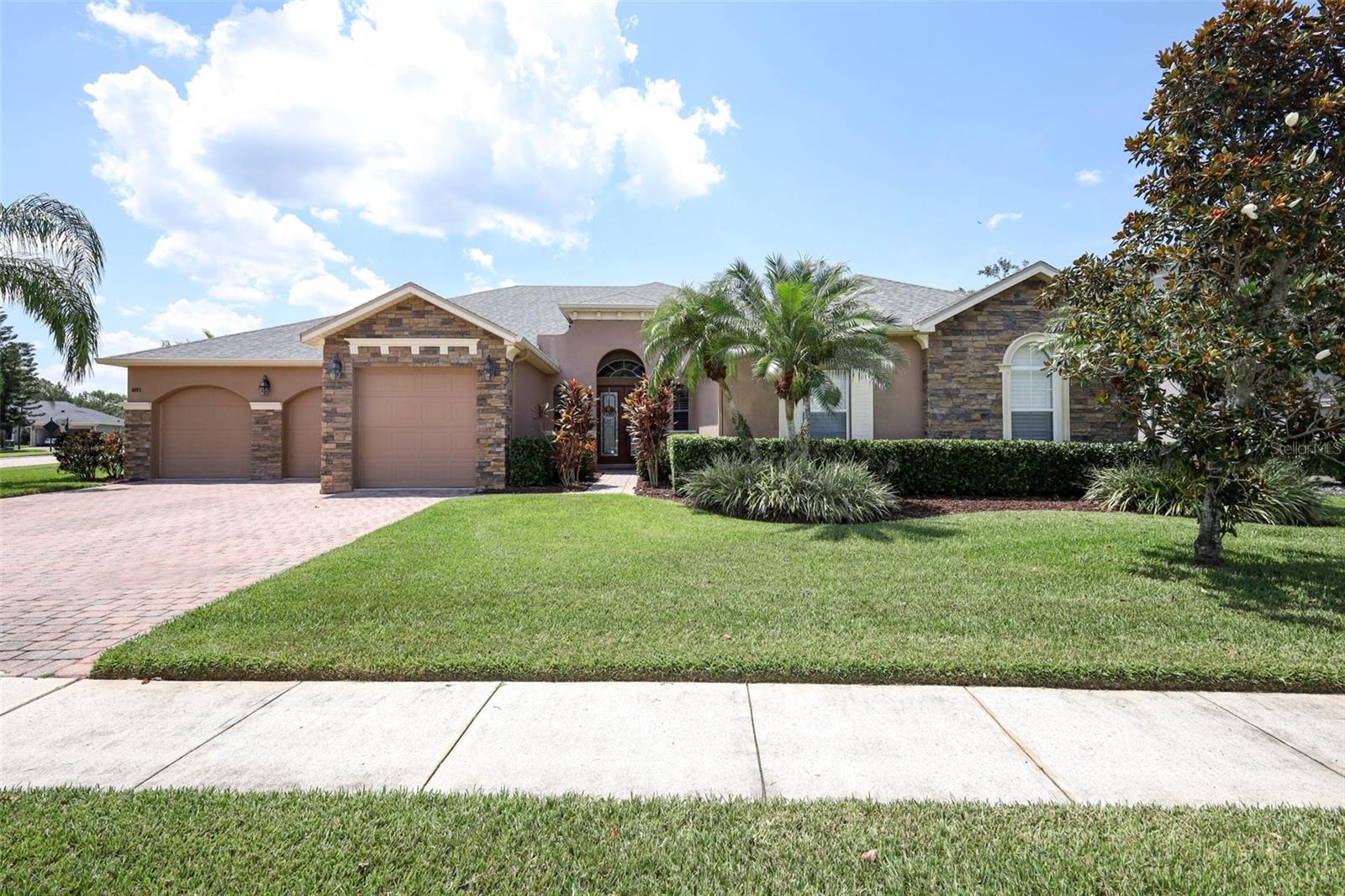 Welcome to this beautifully upgraded and energy-efficient 4-bedroom, 3-bathroom pool home, offering 3,096 square feet of comfortable living space, located in the highly sought-after Hawks Reserve section of The Sanctuary. Built in 2005, this meticulously maintained home blends spacious design with modern upgrades—perfect for today's lifestyle. One of the home’s standout features is the fully owned 18kW solar panel system, installed in 2023. PEARL Certified and equipped with real-time monitoring, this system offers average monthly electric bills of just $30, with no lease or loan to assume, providing substantial utility savings and long-term value. Inside, the open-concept layout includes a large kitchen with ample storage, formal living and dining areas, and soaring 12-foot ceilings, 8-foot doors, and plantation shutters throughout, enhancing the home's bright, upscale ambiance. Tile laid on the diagonal spans the main living areas, while bedrooms feature newer carpet for comfort. The chef’s kitchen is both stylish and functional, showcasing Silestone countertops, rich 42" cherry wood cabinetry, and stainless steel appliances. A spacious laundry room adds convenience with abundant cabinetry, a wash basin, and a folding counter. Retreat to the owner’s suite, complete with a cozy sitting area, crown molding, luxurious ensuite bathroom featuring a soaking tub, walk-in shower, dual vanities, and a huge walk-in closet. Additional recent upgrades include Brand-new hybrid hot water heater (2025), 2 new A/C units with smart thermostats (2023). Step outside to your private backyard oasis, where a custom pool (2020) and a massive spa that seats up to 12 adults await, surrounded by an oversized travertine deck—ideal for entertaining or relaxing. The generous corner lot is fully enclosed with a vinyl privacy fence, offering ample space and seclusion. Located in a vibrant community with resort-style amenities including a clubhouse, oversized swimming pool, splash pad, fitness center, basketball and pickleball courts, and scenic parks and trails. You’ll also enjoy proximity to top-rated schools, shopping, dining, and major commuter routes. This rare, solar-equipped home combines elegance, efficiency, and everyday comfort—don’t miss your chance to make it yours!