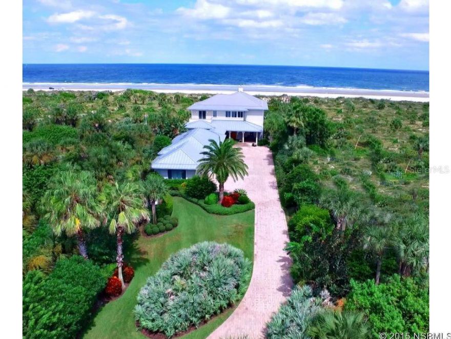 North Beach Oceanfront- Architecture and Eloquence, a home of Beauty and Function. This estate size retreat (approx.1.4 acres) was created to include a 36' lifestyle room with custom built entertainment center, cabinets and book cases that offer visual separation for Living and sunroom . It is Intimacy on a grand scale with captivating views of the natural sea dunes, vegetation and blue ocean, through a 37' wall of Casement windows and fixed glass. Pool and spa are in full view from the upper and lower level of the  home.  Pool house includes bath and storage.  The  Kitchen is fully equipped with dual dishwashers, chefs sink, center island gas/electric cook top with down draft. Walk in Pantry with floor to ceiling built-in shelves.  Executive study nestled in a quiet area with 7' windows for views toward the NEast.  East half of the second floor contains an owners suite equipped with separate 13x15 fitness room. Owners bath is 13x15 with walk in shower and soaking tub. All with ocean views.  Owners closet is 24x 13 with center island dresser storage. A  pocketed entry door to full storage and laundry area for owners personal items. 38' oceanfront covered deck just off the owners suite. All guest bedrooms have private baths.   This estate also includes a separate guest suite situated west of the three car garage. Additional specifications of this estate provided upon request.    aerial photos  https://vimeo.com/142416474 ;Water: City