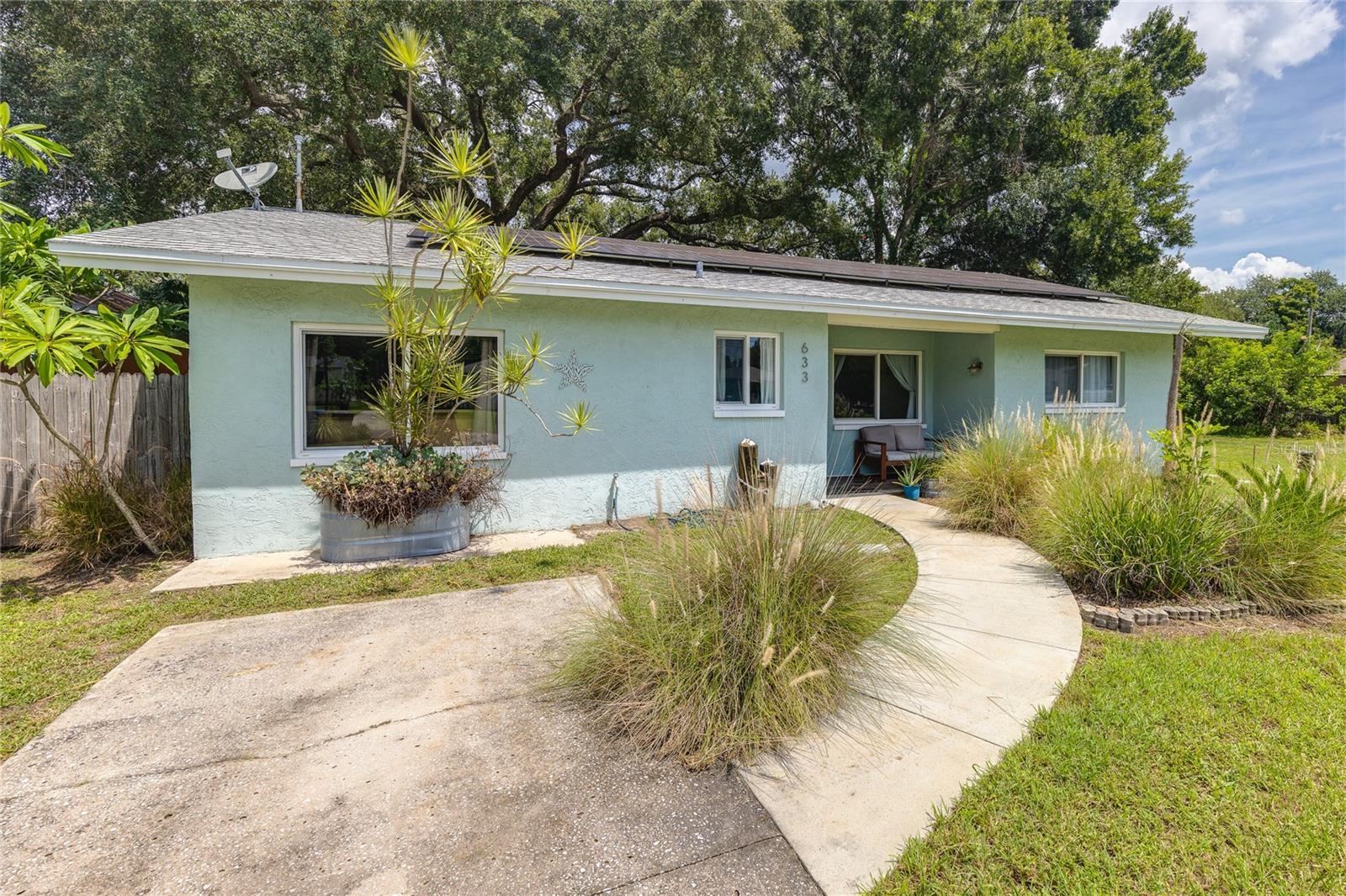 Backyard Bliss & Energy Independence – Your Next Chapter Starts Here. Welcome to this beautifully updated block-build and move-in ready 3-bedroom, 2-bath residence in the highly desirable Edgemoor Estates neighborhood of St. Petersburg. You’ll feel like you’re in nature, yet you’re only minutes from the city. Offering 1,505 sq. ft. of thoughtfully designed living space on a spacious 10,484 sq. ft. lot, this home combines modern upgrades with the serenity of a large, shaded backyard. Best of all, it has not had any water intrusion during all storms and hurricanes. Inside, you’ll find: -Porcelain tile floors throughout for easy maintenance and style -A renovated kitchen with upgraded cabinetry, pantry storage and premium appliances -An open-concept floor plan flowing into a welcoming living room with a wood-burning fireplace -A custom quartz desk/workspace, perfect for remote work or creative projects -A split-bedroom layout, including a spacious primary suite with built-out closets and a large shower - Secondary bathroom has a bathtub -Indoor laundry room with washer and dryer included - Large windows throughout for plenty of natural light. Energy Independence is a standout feature here: - Roof-top solar panels (paid off, installed in 2020) - Spray Insulation in Attic - Energy-efficient hot water heater (replaced in 2020) All will help significantly lower monthly utility bills! Your Private Backyard Retreat: -Shaded by majestic 200-year old oak trees -Fully fenced backyard with ample room for entertaining, gardening or play -Areca, coconut, and foxtail palms along fence line for added privacy -Treehouse with zip line -Above-ground pool deck and electrical wiring, ready to install a new Intex 24' x 12' x 52" Ultra XTR Deluxe Rectangular Above Ground Swimming Pool. Major updates include: -Architectural Shingle Roof (installed in 2015) -A/C system with UV cleaning system (installed in 2015, regularly serviced) -Plumbing (replaced in 2015) Prime Location Benefits: -Around the corner from the new Speer Aquatics, Fitness Center and Mangrove Bay Middle School -Around the corner from Puryear Park with tennis courts, kayak launch, playground, running trail and soccer fields -Nearby Shorecrest Preparatory and Shore Acres Elementary -Convenient access to scenic trails to downtown St. Pete (20-minute bike ride or 10-minute drive) -5-minute drive to Publix, Whole foods, Trader Joes and Crunch Fitness. This property offers the perfect balance of modern convenience and natural tranquility—all in one of St. Pete’s most welcoming neighborhoods.