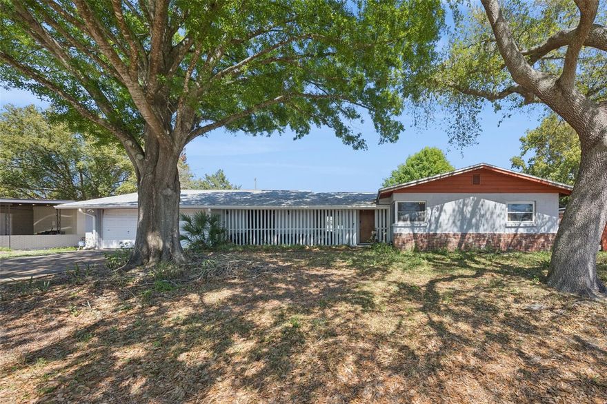 Welcome to 1623 Baltimore Drive — ideally located in the heart of Orlando, where you're close to Downtown, Winter Park, and College Park and can enjoy the benefits of community amenities without the burden and headache of an HOA. In 2023, this home underwent major upgrades including a brand NEW roof, NEW HVAC system, NEW gutters, hurricane-impact sliding glass doors, and renovated bathrooms—giving you true peace of mind from day one.  From the moment you step inside, you’ll appreciate the authentic mid-century charm, highlighted by stunning terrazzo floors that bring both style and durability. This iconic flooring not only adds a sleek, retro aesthetic, but also keeps the home cool and low-maintenance—perfect for Florida living.  The layout offers a comfortable flow with multiple living and dining spaces, giving you flexibility whether you’re entertaining or enjoying a quiet night in. Large windows invite in natural light, enhancing the home’s warm and inviting feel.  But what truly sets this home apart?  You’re situated on a private, oversized lot of over a quarter acre, yet still enjoy access to Kingswood Manor’s private resident-only amenities—including a pool, clubhouse, tennis courts, basketball court, and a sprawling 4-acre park.  That means you get all the perks of a community lifestyle without paying a monthly HOA fee.  It’s a rare combination that’s hard to find in Orlando.  Step outside and enjoy a spacious backyard with plenty of room to relax or entertain.  One of the biggest advantages of this home is its central location.  You’re just minutes from Downtown, Winter Park, and College Park, giving you quick access to some of the area’s best dining, shopping, and entertainment. Whether it’s a night out at Lake Eola, brunch on Park Avenue, or a quick coffee run in College Park, everything you love about Central Florida is right at your fingertips. With all major systems replaced in 2023 and access to premium amenities without the HOA cost, this is a true standout opportunity.  This home can be purchased with no money down or no income verification!