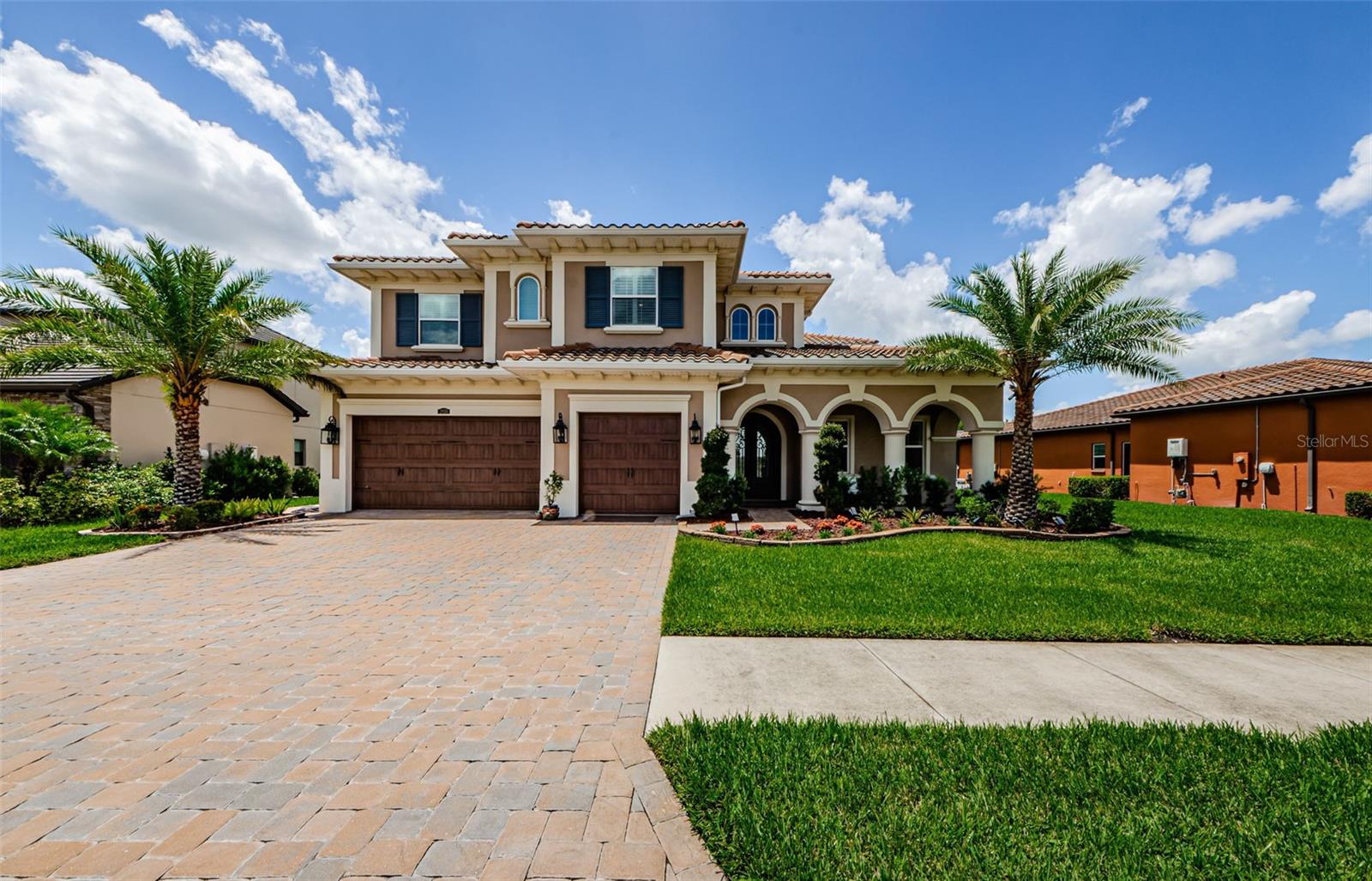 Step into luxury in owning this breathtaking 4-bedroom, 4-bathroom estate located in the highly sought-after gated community of Estancia. From the moment you arrive, the wrought iron double doors with decorative glass set the tone for the grandeur that awaits inside.
The dramatic foyer features wood ceiling beams, polished porcelain tile flooring throughout the main level, and a stunning staircase with dark and wood stairs and wrought iron banister. Your eyes are immediately drawn to the Juliet balcony and the dazzling crystal chandelier overhead—just one of many elegant touches.
To your right, a private home office with custom built-in desks and storage offers the perfect work-from-home space. The formal dining room with coffered ceilings is ideal for entertaining guests and hosting special gatherings.
The heart of the home is the spacious living room with a sleek stone electric fireplace and views of the pool area, pond and conservation creating a serene ambiance for relaxing evenings.
The chef’s kitchen is a showstopper, complete with a Built-in gas cooktop and decorative range hood, Dual convection ovens, microwave, and stainless steel refrigerator, Quartz countertops, farmhouse sink, and oversized island with stylish pendant lighting. The home also includes a whole house water softener system by Rain Soft.
On the main floor, a guest bedroom and full bath offers convenience and privacy—perfect for in-laws or visitors—with easy access to the pool area.
Upstairs, the primary suite impresses with wood flooring, tranquil views of the conservation and pond, and private access to the upstairs balcony. The spa-like en suite includes: Dual vanities, Garden tub and large walk-in shower, Custom-designed walk-in closet. Also upstairs: a media room with balcony access, two additional bedrooms, two full bathrooms, and a utility room with sink and built-in storage.
The outdoor living area is simply spectacular. A true extension of the home, it features: a Full outdoor kitchen with Alfresco gas grill, Kamado Joe smoker, power burner, side burner, sink, and beverage refrigerator, Custom bench seating in light wood.
This home offers one of the tallest panoramic screened cages (polystyrene material, hurricane-resistant) with a 45x22 saltwater pool with bubblers, pool lighting, waterfall, and chlorine generator and a Built-in fire pit for cozy evenings outdoors.
There are too many upgrades to list—from the high-end finishes to thoughtful design choices, to a whole house water softener system to outdoor security system this home is truly one-of-a-kind.
Don't miss your chance to experience this exceptional lifestyle in Estancia. Contact me today to schedule your private showing and see what makes this home a dream come true.