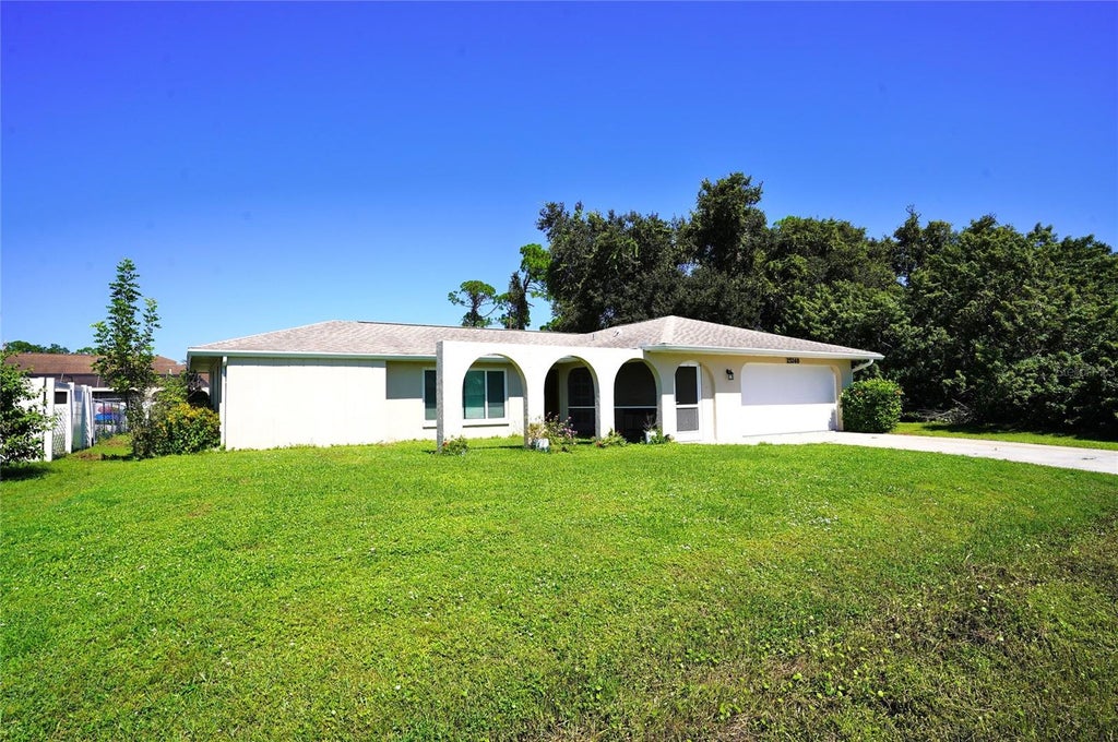 Photo of 23240 Mcburney Avenue, Port Charlotte, FL 33980 (MLS # C7532195)