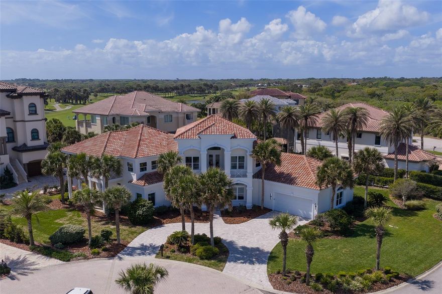 COASTAL MODERN PERFECTION | Steps from the Atlantic in Grand Mer, Hammock Dunes    
Experience the pinnacle of beachfront living in this masterfully re-imagined estate, located in the most prestigious Grand Mer neighborhood on the northeast corner of the gated Hammock Dunes community. Situated at the end of a quiet cul-de-sac and positioned within an enclave of exquisite oceanfront homes, this residence offers the ultimate luxury - your feet in the sand within a two-minute stroll from your front door.   
THE TRANSFORMATION - Following a $1M+ comprehensive renovation, every inch of this home has been curated with the savvy details of a Ritz Carlton residence. From the 2018 tile roof down to the brand-new white oak flooring, the home radiates a "Modern Coastal" flair that balances sophistication with livability.  The heart of the home is a chef’s dream featuring custom white oak cabinetry and an oversized prep island. Professional appliances include a 48” refrigerator, 8-burner gas range, and integrated beverage center and a massive hidden walk-in pantry designed for the ultimate host.  
SEAMLESS FLOW - The open-concept great room features a modern 3 sided electric fireplace and 12' sliding glass doors that flood the space with natural light. 
SOPHISTICATED ACCOMMODATIONS - Designed for multi-generational comfort or grand-scale entertaining, the layout maximizes every square foot.  Dual primary suites - A luxurious primary retreat on the main level plus a second primary suite upstairs featuring an ocean-view balcony and a walk-in closet plumbed for secondary laundry. Five full & two half baths are updated with designer finishes. 
WORK OR PLAY - A versatile second-floor bonus space with two private balconies and a quiet home office. 
OUTDOOR OASIS - The lanai serves as a private resort, featuring an open-air saltwater pool and spa, a fully-equipped summer kitchen, and retractable hurricane panels for effortless security and lock-and-leave peace of mind. 
RARE QUALITY AND PEACE OF MIND - Construction - high-quality build in an X Flood Zone. 
PROTECTION - Full hurricane impact windows and doors throughout.  
THE CLUB - Membership to the Platinum-rated Hammock Dunes Club is available, offering world-class golf and oceanfront amenities just steps away.