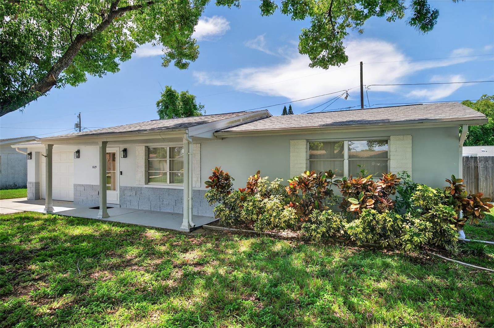 Great starter home! No HOA no flood insurance. High and dry at approx 52 ft above sea level. This charming 2 bedroom 2 bath home greets you with 2 beautiful Camphor Trees which keep the whole front of the home shaded. The fenced yard is an over sized lot. Totaling about 1 an 1/2 lots. There is a front storm door and storm shutters on the windows at the back of the house. The kitchen has custom wood cabinetry with plenty of storage. The back porch can be open air or closed off by sliding windows. The roof is 2020, completely repurposed ac in 2023, water heater 2022 and updated electric panel. The septic system was pumped just before listing. Come see this great value for your money! This home qualifies for Down Payment Assistance or up to $17,500 in grant money with specific lender. Call for qualifying details!
