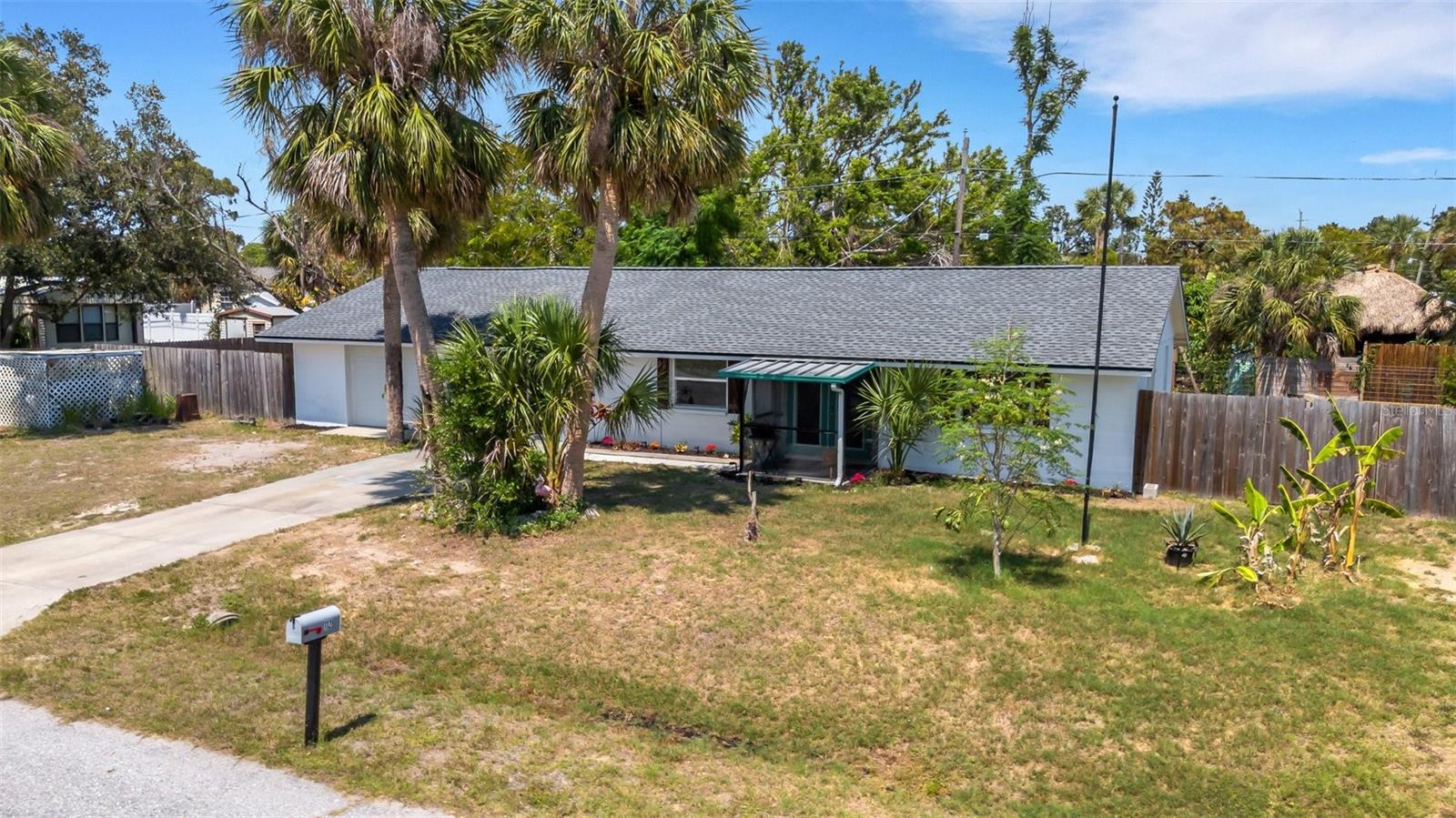 One or more photo(s) has been virtually staged. WHAT A LOCATION!! NON-FLOOD ZONE HOME WITH NO HOA ON 0VER 10,000 SQUARE FEET OF LAND!! PLENTY OF ROOM AND PARKING FOR ALL YOUR RECREATIONAL TOYS! 'A' RATED SCHOOLS; UNDER 2 MILES TO LEGACY TRAIL; THREE MILES TO THE BEACH; LESS THAN 4 MILES TO HIGEL BOAT AND KAYAK LAUNCH ON VENICE ISLAND AND UNDER SEVEN MILES TO CASEY KEY BOAT LAUNCH. GRAVEL PULL-OFF TO GARAGE TO BE COMPLETED WEEK OF 8/11. Superior location not only to these previously noted destinations but also to some of the best waterfront hang outs for dining and fun in Sarasota such as Nokomos, Dockside, and Pop’s Sunset Grill. This home, with 3 Bed/ 2 Bath, has a spacious covered screened lanai and sizable fenced rear yard where you can create a wondrous retreat for family and friends to enjoy- even offers space for a pool if that suits your pleasure. The land area of this property provides ample parking whether for auto, RV, boat, work trailers, or any other equipment or recreation; or even space to expand the home. New are the roof and water heater and newer are the updated baths, AC, garage door, double glass front doors and most windows. According to the previous listing the septic tank and field were newly installed in approx. 2019- seller had tank pumped 2024. This home is connected to public water. The deep one car garage provides space for the car and is also equipped with a workshop. One block over is Merkle Park with shuffleboard and playground. You gotta check it out!