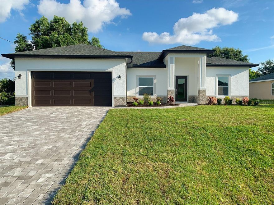One or more photo(s) has been virtually staged. NEW CONSTRUCTION - 4 BEDROOMS - MOVE IN READY!! Closing cost incentives available! Beautiful split floor plan with hurricane impact, low-E windows and doors. Includes a full 1-year warranty and 10-year structural warranty. Prime location with easy access to I-75 and close proximity to shopping and dining. Inside, enjoy an open layout, high tray ceilings, and elegant porcelain tile throughout. The bright living area opens to a generous covered lanai. The spacious kitchen is equipped with 42" upper cabinets, a pantry closet, and premium granite countertops. The primary suite features TWO walk-in closets and a gorgeous bathroom. Great outdoor area with irrigation system and upgraded landscaping. The front is tastefully finished with stone accents and a brick paver driveway. Additional features include a decorative impact-glass front door, extra linen closets, laundry tank, storage niche in garage, interior window sills, high-efficiency A/C system, Moen shower valves, and dimensional shingles. Great opportunity to own a brand-new home that’s efficient, low-maintenance, and loaded with upgrades!