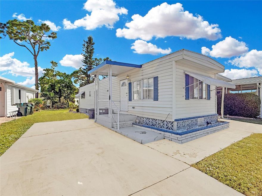 One or more photo(s) has been virtually staged. Discover your perfect Florida retreat in this inviting 1972 Mana mobile home, ideally located within a vibrant 55+ gated community in sunny North Port. Whether you're a seasonal snowbird or seeking a peaceful retirement oasis, this home offers a comfortable, carefree lifestyle in the heart of Florida’s beautiful climate. <P><br><br />
Stay active within the community enjoying amenities such as two heated pools, two clubhouses, a fitness center, a large community library, pickleball, tennis, shuffleboard, bocce, horseshoes, billiards, and more. Additionally, the community keeps a full social calendar including: regular dinner and lunch socials, picnics and ice cream socials, bingo and mahjong game nights, dances with live bands, monthly movie nights, craft fairs, arts and ceramics classes; as well as scheduled horseshoe games, bocce ball and pickleball games, shuffleboard games, table tennis games, card games and cribbage, exercise classes including pool walking and water aerobics, line dancing, social guitar playing, zoomba, bowling and knitting/crochet. There is a men’s social club and a women’s social club, men’s and women’s golf, biking club, darts, kayaking club, and wood carving. Besides socializing and staying active, the community has also organized a food pantry and fulfills medical equipment needs for community members! <<P><br><br />
After an enjoyable day or evening out within the community, find quiet retreat within your move-in ready and tastefully furnished home. Inside, you’ll find a bright, open floorplan with easy-care ‘wood-look’ luxury vinyl flooring, easy to clean and perfect for low-maintenance living. The modern kitchen features all essential appliances, attractive white cabinets, under-cabinet lighting, and plenty of counter space and cupboards—ideal for preparing fresh, local seafood or hosting neighbors. <P><br />
At the rear of the home find two bedrooms and a full bathroom with a shower-tub combo. Within the large bathroom you’ll also find a stackable washer and dryer hookup, offering convenience and comfort—with no need to venture outside on hot days to do your laundry! Speaking of outside, Imagine spending mornings within your spacious screened lanai, basking in the warm sunshine or letting down the provided sunshades to relax in the fresh air and shade (and scent of the nearby lemongrass!). This can be the extent of your outdoor time if you would like as the community takes care of all lawn and shrubbery maintenance! <P><br><br />
Recent upgrades like a new roof and insulation (2023), 2" foam insulation added to the walls (2010), low-e glass windows, and a twice a year maintained AC system keep your living environment cool and energy-efficient. Seamless gutters and downspouts were added in 2016.
The cherry on top is this home’s location which provides easy access to nearby shopping of all kinds, many dining options and plenty of medical facilities, making it the ideal place to enjoy your best years under the Florida sun. <P><br><br />
Don’t miss the opportunity to own this well-maintained home in a wonderful community—schedule your showing today!