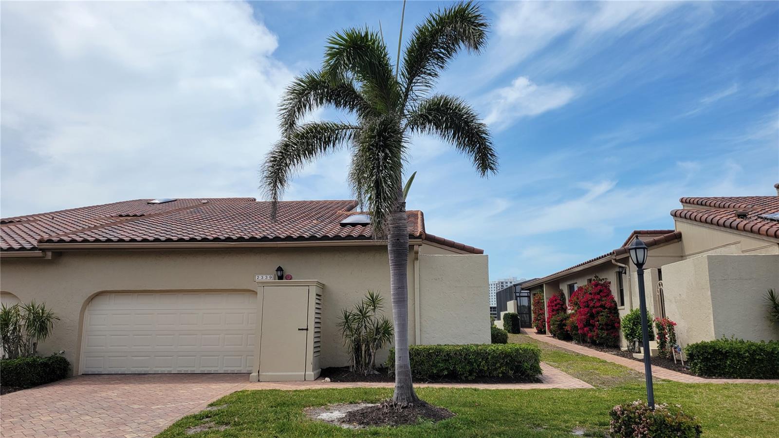 Seasonal/short term rental on Longboat Key Beautifully renovated 3 bedroom 2 1/2 bathroom villa right on the golf course in prestigious, guard gated, Bay Isles. This spacious light filled delight has vaulted ceilings with sky lights, and new high impact windows and doors. The open floor plan is perfect for family time and entertaining. The kitchen is very large and has solid cherry wood cabinetry, topped with quartz counters, breakfast bar, massive butlers pantry, breakfast bar and an eat in space and stainless steel appliances. The flooring is all solid surface, either tile or wood so no carpeting. The main bedroom has his and her closets, ensuite bathroom with dual sinks, soaker tub, water closet and walk in shower. The screened in lanai has two levels and plenty of space for entertaining, and an outdoor kitchen. Just outside the gate is the Bay Isles Beach Club with beach access on the Gulf, BBQ grills and covered outdoor dining, and volleyball court. This amazing villa is available during high season (December thru April) at $10,995 per month, or off season (rest of the year) at $5,000 + tax. Call today to sign up for your time in paradise!