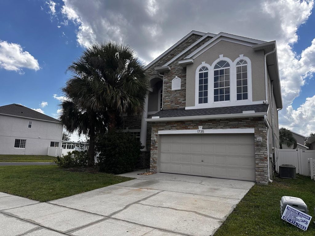Photo of 1735 White Heron Bay Circle, Orlando, FL 32824 (MLS # O6408928)