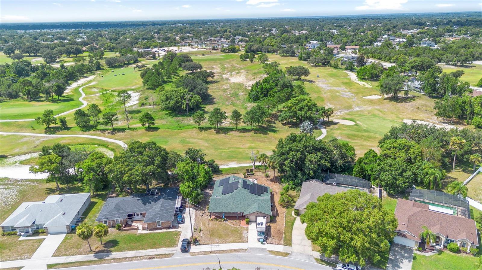 One or more photo(s) has been virtually staged. NEW TO THE MARKET! Come see this truly unique 4 bed / 3 bath home ON 11TH HOLE AT THE DELTONA CLUB GOLF COURSE, DESIGNED BY FAMED GOLF COURSE ARCHITECT BOBBY WEED. This spacious multi-generational home boasts solar panels (Seller will pay off at closing), with a back-up so you never have to worry about going without power, YES YOU CAN GO COMPLETELY OFF GRID. Reverse osmosis in the kitchen, fresh interior paint, newer luxury vinyl flooring, hot tub, and Home Warranty. The location couldn't be better, near Amazon facility (get packages quicker), hospitals, shopping areas, close to I-4 and the beaches, Deltona high school, and soon-to-be downtown Deltona vibe. Roof and solar 2023. Four point and wind mitigation inspections available.