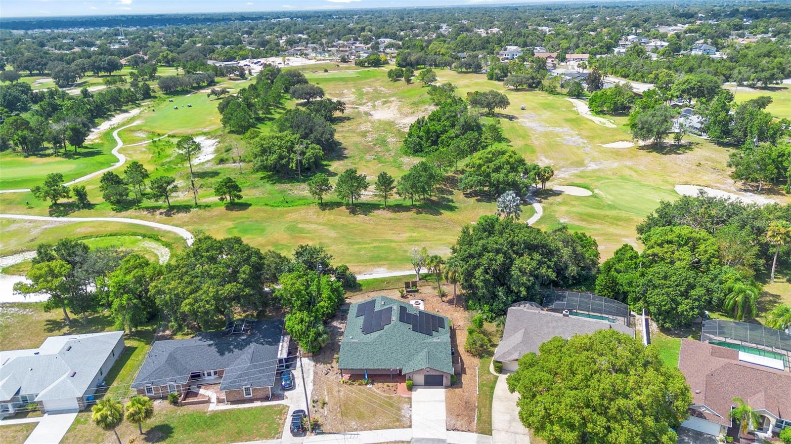 One or more photo(s) has been virtually staged. NEW TO THE MARKET! Come see this truly unique 4 bed / 3 bath home ON 11TH HOLE AT THE DELTONA CLUB GOLF COURSE, DESIGNED BY FAMED GOLF COURSE ARCHITECT BOBBY WEED. This spacious multi-generational home boasts solar panels (Seller will pay off at closing), with a back-up so you never have to worry about going without power, YES YOU CAN GO COMPLETELY OFF GRID. Reverse osmosis in the kitchen, fresh interior paint, newer luxury vinyl flooring, hot tub, and Home Warranty. The location couldn't be better, near Amazon facility (get packages quicker), hospitals, shopping areas, close to I-4 and the beaches, Deltona high school, and soon-to-be downtown Deltona vibe. Roof and solar 2023. Four point and wind mitigation inspections available.
