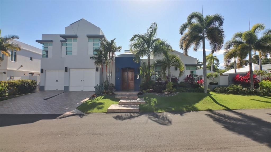 This exquisite home with recently added and updated items to include custom pool, bathrooms, kitchen interior, LG washer and dryer with pedestal drawers, exterior kitchen, covered hot tub, detached office, solar power, solar hot water, cistern and water purification system. There is one master suite on the first floor and a second master suite on the upper floor, both with ensuite bathrooms and walk in closets. Off street parking with 2 car garage.
Paseo Las Palmas is an upscale community consisting of only 38 residences with large homesites which is located inside the Paseo de Dorado Gated Community with 24-hour security that also backs up to the east side of the Dorado Beach Ritz Carlton Community. This prime residence location is on the northwest corner of Calle Palma de Mallorca and Calle Palma Primavera and enjoys comfortable ocean breezes in a private setting with corner influence and open vistas.
New outdoor kitchen: Full outdoor kitchen including gas range, refrigerator, oversized sink with disposer, kohler Sous Pro-Style Single-Handle Pull-Down Sprayer Kitchen Faucet, reverse osmosis water to dispenser and icemaker, and large custom concrete countertop that comfortably seats eight adults.
Amenities: Designer pool including waterfall with heated outdoor shower and covered area with 6 person hot tub. slate pool table and foosball table. Event lawn area.
Organic Garden: Many volunteer sprouts to include spinach, tomatoes, basil, habaneros, jalapenos, turmeric, oregano and ginger. Two lime trees and one mango tree.
Solar System and Generator: Coordinating redundancy electrical systems to always be in power. The solar system generates approximately 40 to 60 kWh per day and is approved by AEE to purchase back excess electricity generated during the day. The system can also be placed in “Mini Grid” mode to work effortlessly with the battery without any connection to AEE for any long period of power outage.
Water System: 600 gallon roof top cistern
Information from reliable sources but is not guaranteed. Home is being sold “as is”.