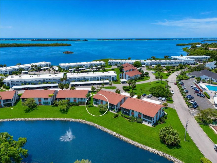 INTERIOR PHOTOS ARE HERE! A RARE AND EXCITING OPPORTUNITY AWAITS in this vibrant bay and canal-front community where coastal surroundings meet the ease and elegance of essentially new construction. Perfectly positioned in a peaceful setting just moments from community amenities and the clubhouse, this residence offers the best of both tranquility and perfection. BOASTING THE LARGEST FLOOR PLAN available, this thoughtfully reimagined home delivers effortless single-level living with the added benefit of covered parking right outside your front door and a small patio in back. Inside, abundant natural light pours through impact windows with 2” blinds, illuminating an open-concept design that feels both expansive and inviting. Serene water and fountain views create a picturesque backdrop, often visited by birds, bringing a sense of calm and connection to nature. EVERY DETAIL has been meticulously considered in this complete top-to-bottom transformation. From new studs, drywall, plumbing, and electrical systems to spray foam insulation and smooth-texture walls and ceilings this home offers the peace of mind and quality of new construction within an established, sought-after community. THE INTERIOR DESIGN strikes the perfect balance of modern sophistication and comfort. Luxury plank flooring flows seamlessly throughout, complemented by fresh creamy paint, shaker-style cabinetry with crown molding, clean line millwork, and two-panel doors with lever handles. Quartz countertops, classic tiling, brushed metal hardware and fixtures, and a full suite of modern lighting and ceiling fans enhance the home’s refined aesthetic. The chef’s kitchen showcases a top-of-the-line GE appliance suite designed to delight every cook. THE INTELLIGENTLY DESIGNED split-bedroom floor plan ensures privacy for all, with a dedicated hall separating the living areas from the spacious bedrooms and baths. Both bathrooms evoke a spa-like experience, each featuring beautifully designed walk-in showers. ADDITIONAL HIGHLIGHTS include a 2019 roof with a third nail for enhanced structural integrity, a 2022 HVAC system, new ductwork, new instant hot water system, 150amp electrical panel with arc fault breakers, new wiring, receptacles, switches, and dimmers. Plus, an abundance of storage throughout. The exterior showcases new and refreshed landscaping. THIS IS MORE THAN A HOME- it’s a unique opportunity to enjoy timeless modern, worry-free living in a well-established waterfront community. Properties of this caliber, combining location, design, and quality, are exceptionally rare. DUES COVER water, sewer, trash, recycle, pest control, cable with HD box, internet with router, exterior maintenance/repairs/replacement, landscape maintenance, insurance. COMMUNITY FEATURES remodeled clubhouse, banquet room, billiards, ping-pong, library/game room, lakeside veranda, boat docks, heated pool, tennis, pickleball, shuffleboard, bocce ball, spa, sauna, workshop, chip/putting green, walking paths, butterfly garden, bayfront park, kayak launch/storage, bayside pavilion, lakeside gazebo, bird sanctuary, tidal pond, many lakes, spacious grounds of nearly 90 acres teaming with Florida wildlife, activities/socials! Mt Vernon is amenity rich and maintenance free, offering an unparalleled lifestyle & great value. Have it all just minutes by car, boat & bike from Anna Maria Island’s sugar white sandy beaches, unique shops & delicious dining. Secure your place in this one-of-a-kind coastal retreat!