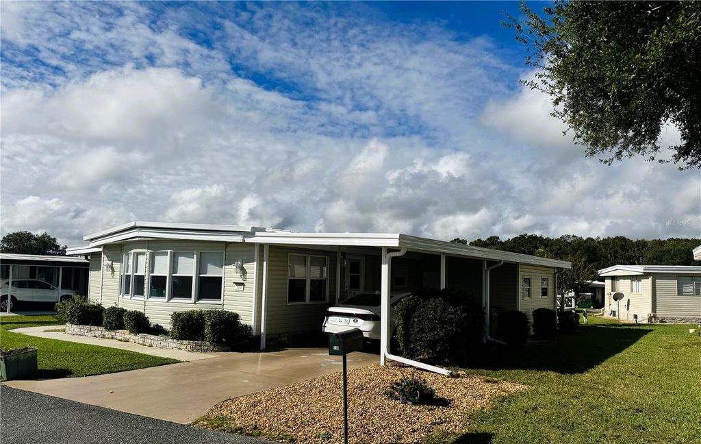 Photo of 110 Gardenia Way, Leesburg, FL 34748 (MLS # R4910059)