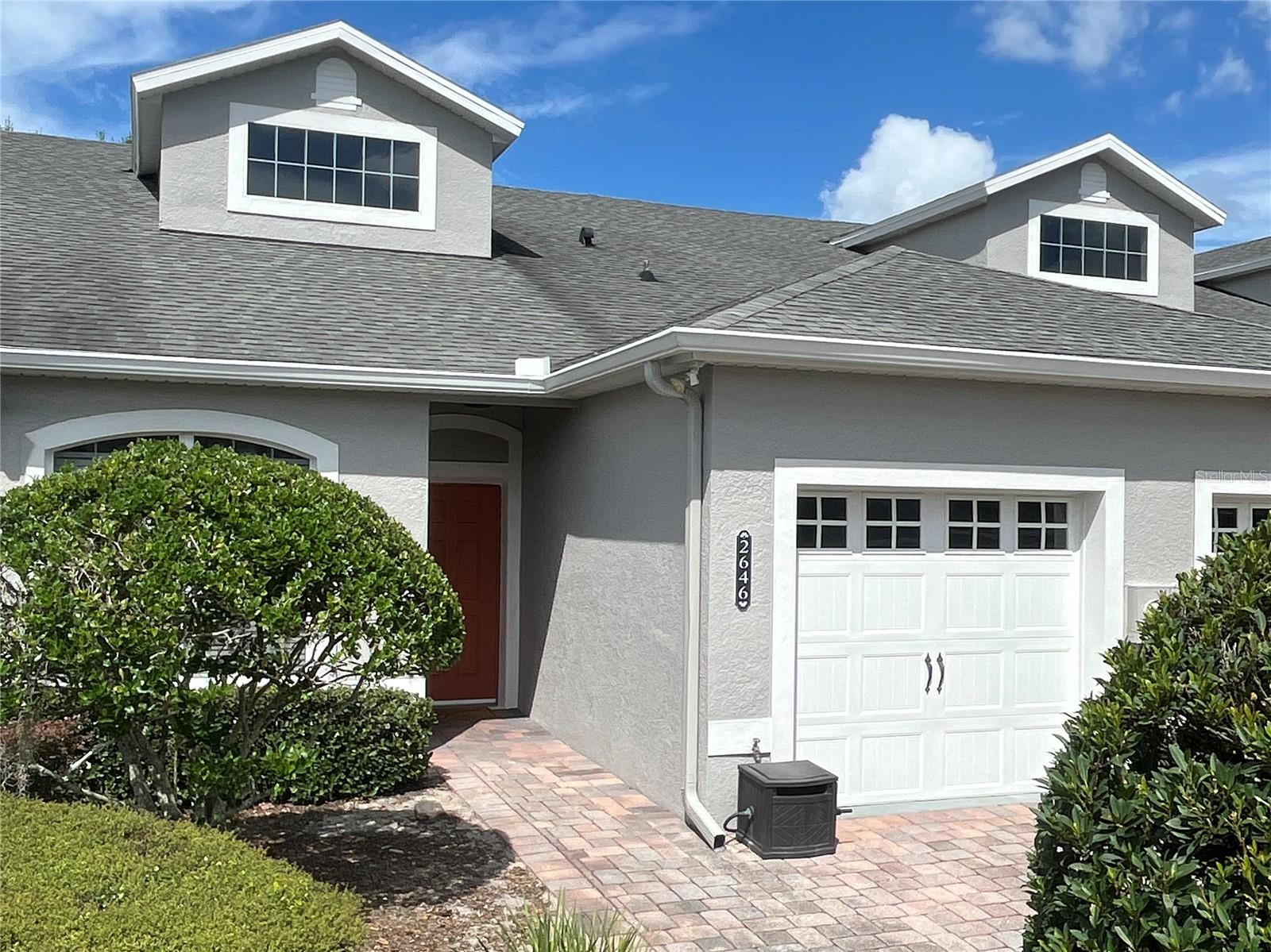 Welcome to this beautifully maintained two-bedroom, two-bathroom townhome with a versatile flex space, perfectly situated in one of Winter Haven's most desirable communities. As you step inside, you’ll be greeted by soaring 16-foot ceilings, an open floor plan filled with natural light, and tasteful finishes that create an inviting atmosphere. Just off the entry, a spacious guest bedroom with an attached full bath offers comfort and privacy, while the primary suite is tucked away at the back of the home, complete with serene views and an oversized 12’ x 5’ walk-in closet. A set of double pocket doors leads to the flexible bonus room, ideal as a third bedroom, home office, den, or even a formal dining room to fit your lifestyle. The kitchen and living areas flow seamlessly together, making entertaining easy and everyday living a joy. Step outside to enjoy the well-kept community, where a sparkling pool overlooks the lake, and a private fishing pier adds to the charm of the neighborhood. The HOA takes care of exterior building and roof maintenance, landscaping, cable, and internet, allowing for truly low-maintenance living. With recent updates including exterior paint in 2025, new appliances in 2021, plus the roof, HVAC, water heater, and bedroom flooring replaced in 2018, this home offers peace of mind and modern comfort. Conveniently located near world-class attractions, shopping, and dining, this townhome is the perfect blend of comfort, convenience, and lifestyle. Don’t miss the opportunity to make this exceptional property your new home in Central Florida.