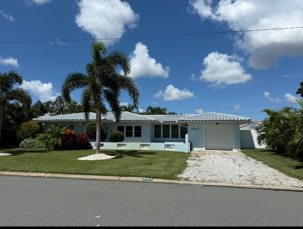 Fully Furnished - Beautifully maintained block home. Located in the lovely neighborhood of Tropical shores, an area of great homes with a lush, relaxed feel and wonderful waterfront park with beach! House has never flooded. Beautiful hardwood floors, updated kitchen with stainless steel, granite and travertine. Home has extra room that could be 3rd bedroom or office and half bath in the garage. Fully fenced in spacious backyard. 2 miles from downtown St. Pete. 1 mile from interstate 275. Conveniently located to Old Southeast Market and Chattaway.