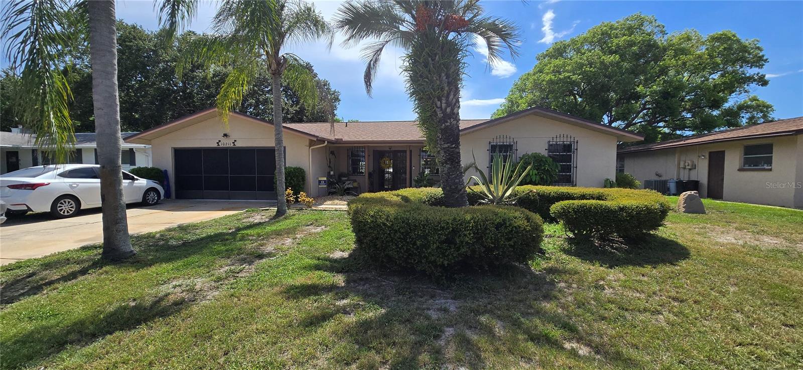 Waterfront Florida Retreat – Ideal for Retirement or Vacation Living!
Welcome to your personal slice of paradise! This delightful 2-bedroom, 2.5-bath, 1,434 sq ft canal-front home is the ultimate haven for relaxed Florida living—perfect for year-round enjoyment, a seasonal escape, or a peaceful retirement lifestyle.
Set on a tranquil private canal, this home invites you to enjoy kayaking, fishing, or simply taking in breathtaking sunsets and shimmering water views right from your backyard. Whether you're sipping morning coffee or winding down at dusk, the serene setting will make every day feel like a vacation.
Designed with comfort and ease in mind, this home features a newer roof, A/C system, and water heater, providing peace of mind and low-maintenance living. The light-filled Florida room at the back of the home is the perfect all-season space for relaxing or entertaining and includes automatic hurricane shutters for extra security.
You’ll love the three separate outdoor seating areas: a welcoming front porch, the Florida room, and two additional covered porches—ideal for enjoying fresh air, reading a good book, or entertaining guests al fresco. The oversized garage includes space for vehicles, hobbies, storage, and even has a shower and screened door, blending utility with comfort.
Inside, the layout is both stylish and practical, featuring marble tile in the living and dining areas, laminate flooring in the family room and primary bedroom, and plush carpeting in the guest bedroom. The kitchen includes a convenient pass-through window, perfect for casual entertaining or easy serving to the Florida room.
Outdoors, the expansive backyard is a lush, tropical retreat with palm trees, blooming flowers, a working fountain, and an irrigation system on a private well for easy care. Whether you’re gardening, hosting, or simply enjoying the breeze, you’ll love the peaceful, resort-style setting.
Conveniently located near shopping, dining, vibrant nightlife, and some of Florida’s most beautiful beaches, this home truly offers the best of both worlds—tranquility at home, and adventure just minutes away.
Start living the Florida dream today—whether you're retiring, snowbirding, or simply escaping to the sunshine, this canal-front oasis is ready to welcome you home.