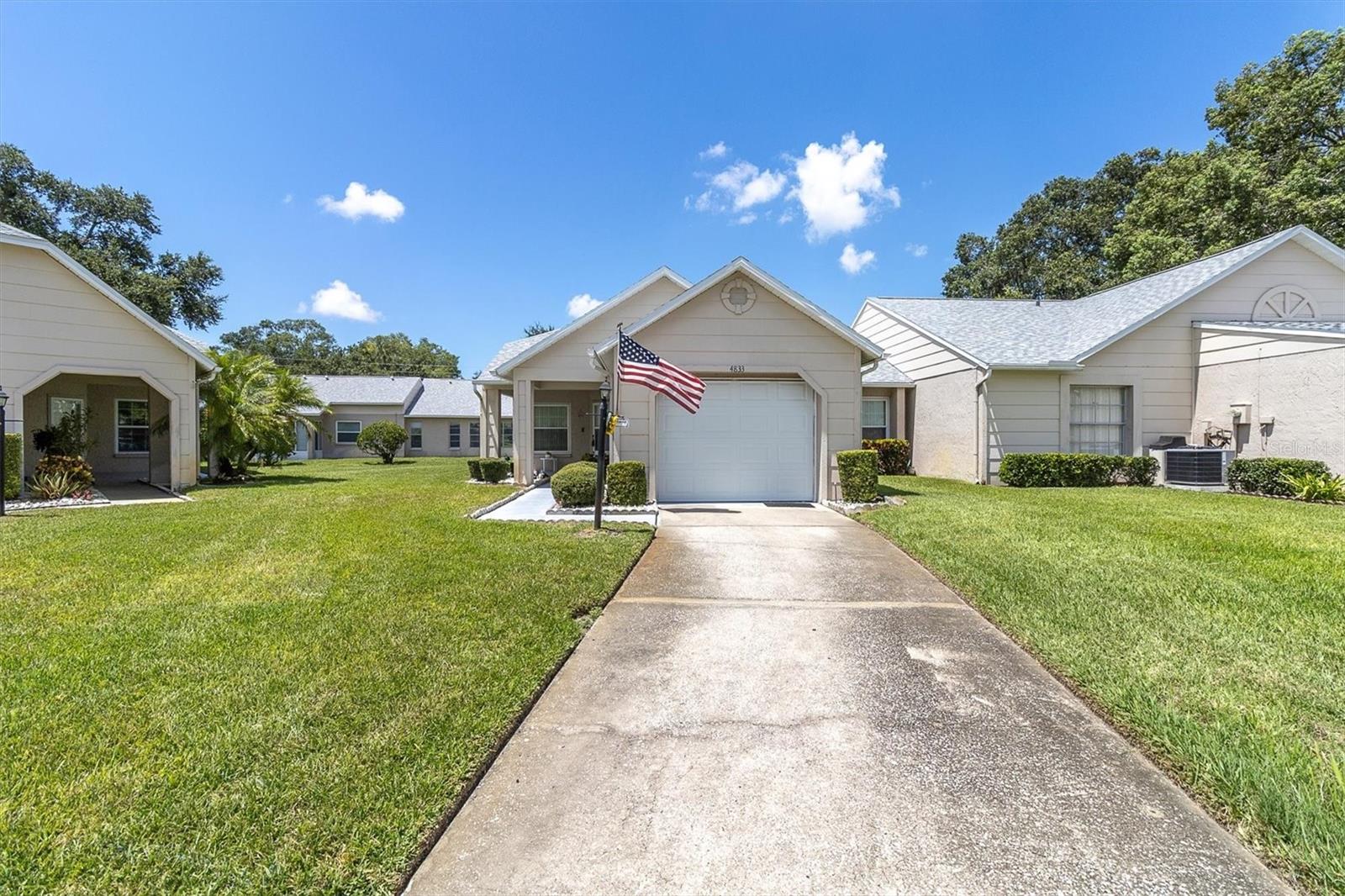 CUTEST AND LOWEST PRICED 2/2/1 CONDO IN THIS POPULAR ADULT COMMUNITY IN THE TRINITY AREA! THIS SWEET DEAL IS GONNA' GO FAST SO BE FIRST IN LINE! OPEN SPACIOUS FLOOR PLAN GREAT ROOM STYLE WITH LAMINATE & CERAMIC IN ALL THE RIGHT PLACES! FEATURING A FORMAL DINING ROOM AND THE EAT IN KITCHEN IS LINED WITH CABINETS, HAS A HANDY PANTRY COMPLETE WITH ALL APPLIANCES! BOTH BEDROOMS ARE A GENEROUS SIZE; THE PRIMARY HAS A NICE WALK IN CLOSET AND PRIVATE UPDATED BATH! EVEN THE GUEST BATH HAS A FEW UPDATES! ENJOY A BREEZY FRONT PORCH! IT IS A SHORT WALK ALONG WINDING TREE LINED STREETS DOTTED WITH SERENE PONDS TO THE ACTIVE CLUBHOUSE THEY OFFER MORE ACTIVITIES THAN YOU CAN KEEP UP WITH... HEATED POOL AND SPA, TENNIS CTS, BOCCE, PICKLEBALL, POOL & BILLIARD ROOM, CRAFTS, LIBRARY, CARD ROOM, EXERCISE CLASSES, DANCES, PARTY'S, BBQ'S THE LIST IS ENDLESS! ADD IN ALL THE AMENITY'S THE TRINITY AREA OFFERS AND THIS IS A STEAL! HURRY TO THIS ON! HESITATE... AND YOU'LL BE TOO LATE!