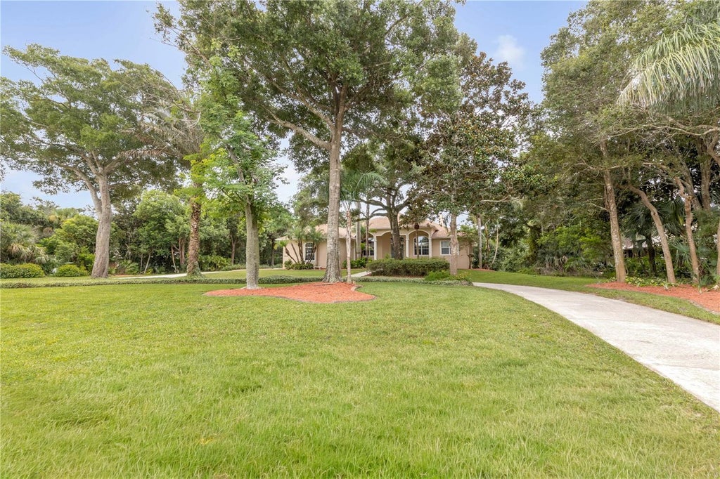 Photo of 5842 Spruce Creek Woods Drive, Port Orange, FL 32127 (MLS # NS1088657)