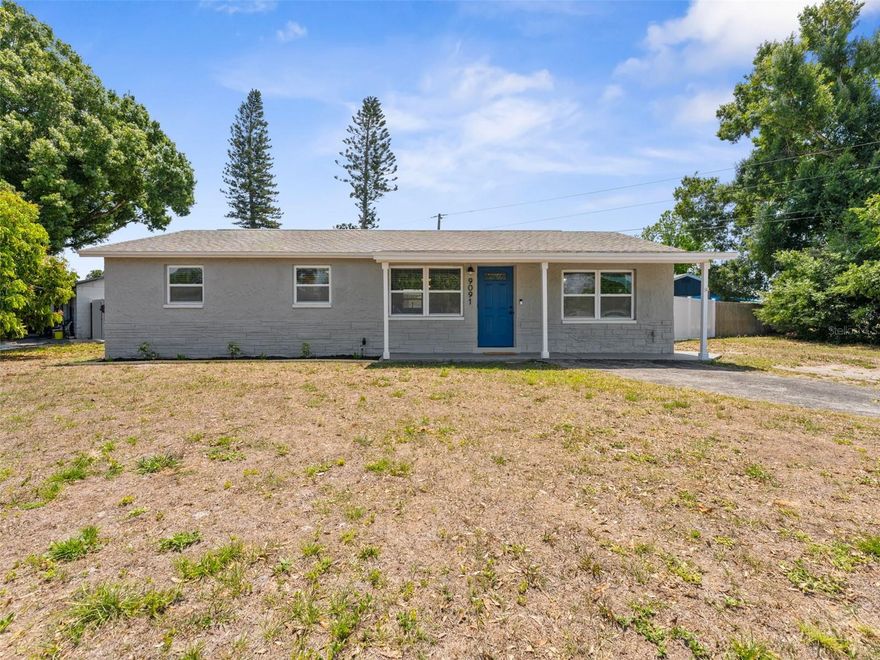 Welcome to this adorable and meticulously maintained 3-bedroom, 1-bathroom concrete block home offering 1,196 square feet of comfortable living space in the highly desirable Bardmoor area of Seminole, where pride of ownership is evident at every turn. Situated high and dry in a non-flood zone on a spacious corner lot, this property boasts outstanding curb appeal with fresh landscaping and an oversized driveway providing plenty of additional parking. Step inside to a tastefully updated interior filled with natural light, featuring luxury vinyl plank flooring that flows seamlessly throughout the main living areas and bedrooms. The spacious dining room easily accommodates a large table, making it perfect for gatherings, while the inviting step-down living room creates a cozy yet open space ideal for relaxing or entertaining. Modern light fixtures and ceiling fans are thoughtfully placed throughout the home, enhancing both style and comfort. The beautifully remodeled kitchen is sure to impress with granite countertops, white shaker-style cabinets with dovetail construction and soft-close features, a stunning glass tile backsplash, and a full suite of stainless steel Whirlpool appliances including a refrigerator, range, microwave, and dishwasher. The bathroom is well-appointed with tile flooring, a tub/shower combination, and a single-sink vanity with convenient drawer storage. All bedrooms are generously sized and feature oversized closets, with select closets offering custom built-ins for added organization and functionality. Additional highlights include custom blinds on every window and a dedicated indoor laundry area with washer and dryer hookups (washer and dryer do not convey) and plenty of room for an office in the over sized laundry room. Step outside to enjoy a covered patio overlooking a private, fully fenced backyard with a new white vinyl fence, offering a low-maintenance outdoor space perfect for relaxing or entertaining, along with a large storage shed (playground does not convey). Major updates provide peace of mind, including a new electrical panel, newer water heater, and a 2019 HVAC system. Ideally located next to Bardmoor Elementary and just minutes from shopping, dining, and entertainment, this home combines comfort, convenience, and charm in one exceptional package—schedule your private showing today and experience all this wonderful property has to offer.