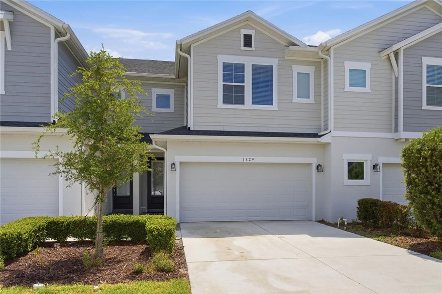 Beautifully maintained David Weekley luxury townhome located in the sought-after gated community of Lake Meadow Landing in Ocoee.  Built with superior craftsmanship and energy efficient design, this stylish residence offers the perfect blend of comfort, quality, and convenience. 1829 Terrapin Road has been exceptionally well maintained and shows like new, having been occupied and meticulously cared for by a single tenant since completion.  The open-concept floor plan features bright and airy living spaces with seamless flow between the kitchen, dining, and family room areas.  The modern chef kitchen offers quality 42” cabinetry, solid-surface countertops, and a spacious island ideal for everyday living and entertaining.  Upstairs, the generous primary suite inclueds a wallk-in closet and private en-suite bath, while additional bedrooms provide flexibility for guests, office space or hobbies.  A large upstairs laundry with brand new washer and dryer and custom shelving further compliments a relaxed daily experience.  Lake Meadow Landing is conveniently located near shopping, dining, parks, golf, a bustling newly developed downtown Ocoee and major roadways.  Lake Meadow Landing offers low maintenance living in one of Ocoee’s most desirable newer communities.  Move-in-ready and truly exceptional,  this townhome is an outstading opportuniy in today’s market.