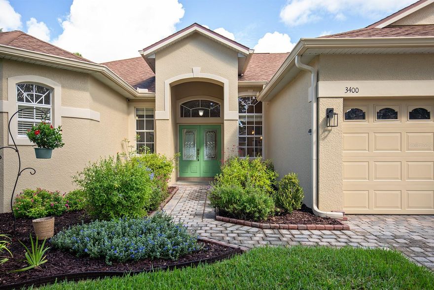 BRAND NEW AC and HOT WATER HEATER installed 10-6-2023, ROOF is 2016.  From the shaded PAVER DRIVEWAY, you walk through a BUTTERFLY GARDEN as you approach the front door. When you enter the home, you are greeted by large OPEN ROOMS with 11-foot ceilings that lead to a SCREENED PATIO and a FENCED yard.  The layout is perfect for entertaining year-round.  This THREE-WAY SPLIT plan allows flexibility for a GUEST SUITE, a secluded office, or game room away from the central area of the home. Flex space off the master bedroom can also be used as a home office or exercise room. The spacious master bedroom and bathroom have HIS and HER WALK-IN CLOSETS, a SOAKING TUB, and a separate WALK-IN SHOWER. There is ample room for a sitting area next to the BAY WINDOWS in the master bedroom. The guest suite also has a walk-in shower for easy access. The remaining two bedrooms and pool bath are clustered together off the family room.  The spacious kitchen has beautiful GRANITE counter tops, 42” cabinets and a large pantry.  The kitchen island accommodates seating, adjacent to the breakfast area. The back yard is spacious with plenty of room to add a pool. There is FRESH PAINT inside and out.  Live Oak Reserve is a sought-after community with RESORT style amenities.  The main entrance is beautiful with a stately oak flanked by lush planting on all sides and a beautiful fountain.   Oak lined streets take you down the main road to the CLUBHOUSE and community POOL.  There is a PLAYGROUND, SPLASH PAD, VOLLEYBALL courts and a large pool slide.  COVERED SEATING and PICNIC TABLES are abundant.  In other areas of the neighborhood, you will find TENNIS and BASKETBALL courts, playgrounds and parks, along with miles of WALKING TRAILS along the main roads.  Ponds and wooded areas add to the beauty of the neighborhood.  TOP RATED SCHOOLS and easy access to restaurants and shopping make this a great place to call home!