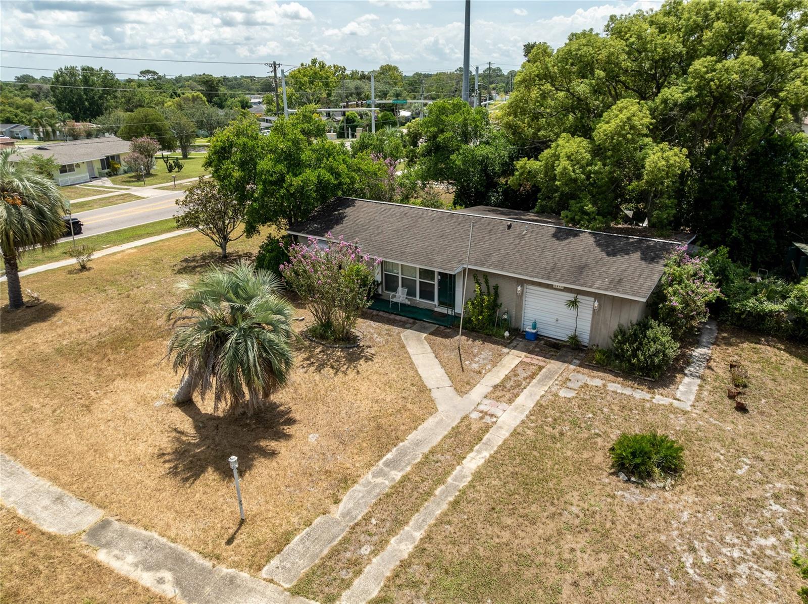 **Charming 2-Bedroom Home with Oversized Yard in the Heart of Deltona!**
Welcome to your perfect Florida retreat! This delightful 2-bedroom, 1-bath home offers comfort, functionality, and style—all nestled in a quiet, convenient Deltona neighborhood.
With 874 square feet of thoughtfully designed living space, plus a closed-in Florida room, this home features easy-to-maintain terrazzo flooring throughout, creating a seamless flow.
Love the outdoors? The spacious, 1/3 acre is an entertainer’s dream—ideal for gardening, pets, storage, or simply soaking up the Florida sunshine. Enjoy even more outdoor living in the inviting *screened-in back patio*, a perfect spot to sip your morning coffee, unwind in the evenings, or host friends in a relaxed setting.
For hobbyists or DIY enthusiasts, the one-car garage comes complete with a built-in shelving—perfect for weekend projects or extra storage.
Additional highlights include:
***No HOA** – Enjoy the freedom to live without added fees or restrictions
***Ideal for first-time buyers, downsizers, or seasonal residents
***Conveniently located
This home is full of charm, character, and possibilities. Don’t miss the chance to own a low-maintenance gem with a spacious yard and unbeatable value.
**Schedule your showing today and make this quaint Deltona your new home!**
**Price reflects the possible maintenance required.**
Call today to schedule your showing. Please note that all information and measurements are intended to be accurate but are not guaranteed. Buyers and their agents should verify all property details, including zoning, schools, HOA rules, pet policies, and other potential uses.