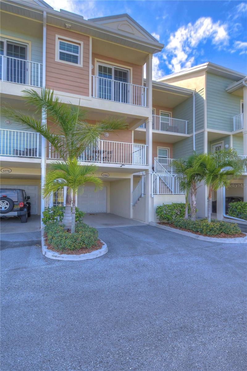 Escape to your own vacation oasis in this impeccably maintained townhome. Nestled along the pristine shores of Tampa Bay, you'll discover a beautiful sandy beach, offering indoor and outdoor dining, as well as endless recreational activities both on and off the water. From sports courts and playgrounds to a marina with boat club access, kayaks, paddleboards, and jet ski rentals, there's no shortage of adventure here. This FULLY FURNISHED unit makes the perfect place to call home, or vacation rental with SHORT TERM RENTALS permitted! Immerse yourself in Florida's breathtaking sunsets, abundant wildlife, and a sprawling fishing pier. Step inside to find a home that exudes coastal elegance, with a bright and airy feel throughout. A beautiful kitchen boasting upgraded white cabinets, quartz countertops, stainless appliances, and so much more! Two spacious bedrooms upstairs both feature walk-in closets and private en-suites. Enjoy the outdoors from one of FOUR expansive balconies, accessible from the living room, bedrooms, and front of the home. A convenient half bath on the main living floor, comfort, and functionality blend seamlessly. A spacious, owned garage boastes added storage shelves. Don't miss out on the opportunity to experience all that this community has to offer. HOA fees include cable, internet, phone, insurance, exterior maintenance, and water, making it both convenient and affordable. Electricity is the only utility you'll need to cover. This home has it all! It’s fully furnished, and offers homeowners no restrictions if you want to make it an Airbnb or long-term and short-term rental! Schedule your viewing today – this is an opportunity not to be missed!