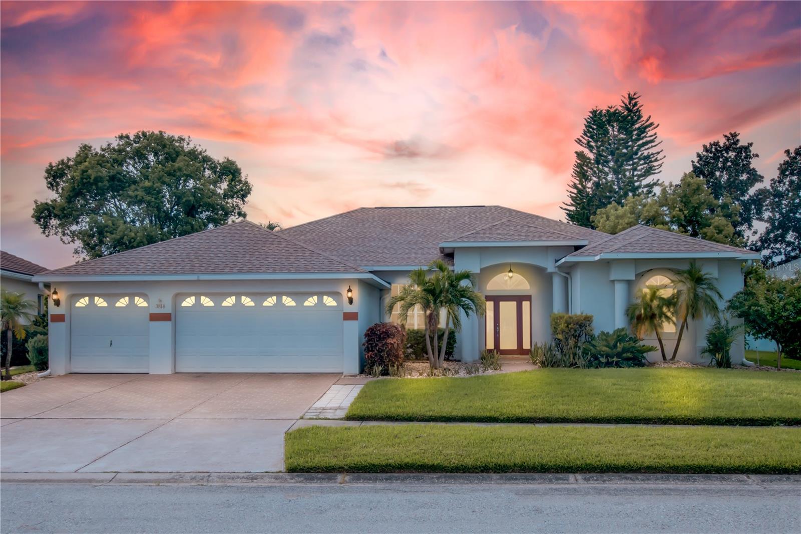 One or more photo(s) has been virtually staged. Welcome to La Paloma Village, a neighborly, golf-cart-friendly community centered around Cypress Creek Golf Club. This beautifully upgraded custom home offers the perfect blend of comfort, privacy, and luxury. A 2025 architectural shingle roof and 3-car garage add lasting value, while mature tropical landscaping creates standout curb appeal. Inside, travertine floors and crown molding guide you through a well-designed layout that includes formal living and dining rooms, two spacious guest bedrooms, and an expansive primary suite with French doors, dual walk-in closets, and a spa-style bath. The gourmet kitchen features granite countertops, maple cabinetry, stainless steel appliances, and a central island, flowing into a sunny breakfast nook and a large family room. Just off the family room, lies the office, which is currently used as bedroom 4. Out back, a screened lanai with an outdoor kitchen leads to a solar-heated, saltwater pool surrounded by tropical landscaping, ideal for relaxing or entertaining. Located on a well-maintained street in sought-after La Paloma Village just minutes from Tampa, St. Pete, Sarasota, MacDill AFB, Tampa International Airport, and St. Joseph’s South, this home delivers the lifestyle you’ve been looking for.