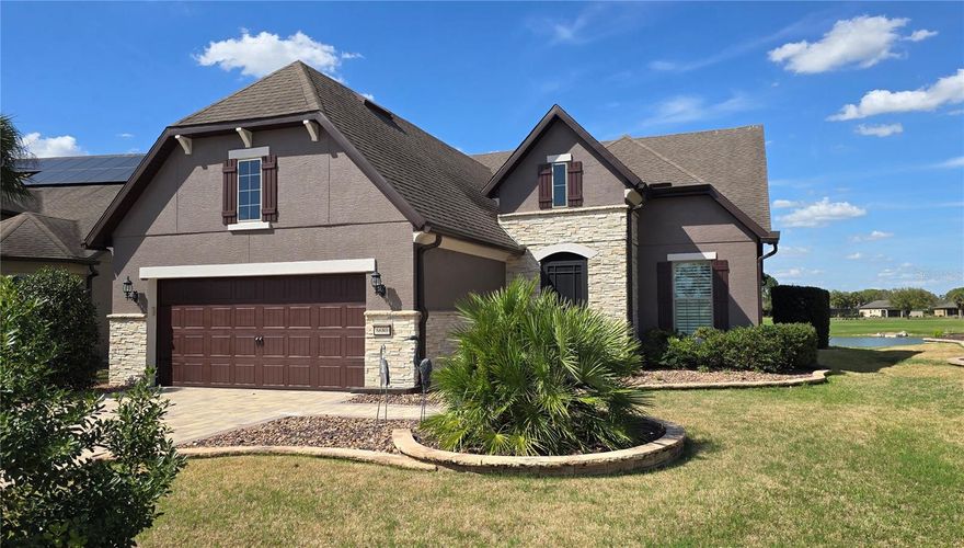 Wake up each morning to stunning golf course and waterfront views, where peaceful surroundings and breathtaking sunsets become part of everyday life. This beautifully maintained home blends thoughtful upgrades, stylish finishes, and inviting spaces designed for both relaxation and entertaining. This lovely house is located in the active adult resort community of Del Webb Stone Creek. At the heart of the home is a recently enhanced kitchen and dining area, where a partial wall was removed to create a more open, airy layout perfect for gathering. The space flows effortlessly and is filled with natural light thanks to new sliding glass doors that lead to the lanai. The kitchen is designed to impress with a huge center island walk-in pantry, and abundant storage, making it both functional and ideal for hosting. For those who love to entertain, the home also features a dedicated entertaining space complete with a wine refrigerator and serving counter, perfect for gatherings with family and friends. Step outside to the pavered lanai with an expansive birdcage, views that make this home so special. recently resealed and ready to enjoy. This outdoor retreat provides the perfect place to relax while taking in the beautiful golf course and water views. The versatile loft retreat adds incredible flexibility, offering its own living area, bedroom, full bathroom, and multiple storage closets, making it ideal for guests, extended family, hobby area, or man cave, or a private getaway space.
Throughout the home you’ll find beautiful flooring, designer ceiling fans, and plantation shutters, along with an interior recently repainted in neutral tones that create a fresh and inviting atmosphere. Storage is abundant, including a custom-designed walk-in closet and additional  walk-in spaces for organization. Even the garage has been upgraded with durable race-track flooring, providing a clean, polished look.
With recent updates, including a new HVAC system, refreshed interiors, and thoughtfully designed living spaces inside and out, this home offers the perfect blend of comfort, style, and scenic Florida living. Stone Creek is a vibrant community with a resort style pool, pickleball and other sports, two clubhouses with bars, a community restaurant, many events planned by the lifestyle office, and a plethora of activities and clubs. Schedule your appointment today to see this fabulous home! (Professional photos coming March 13th)