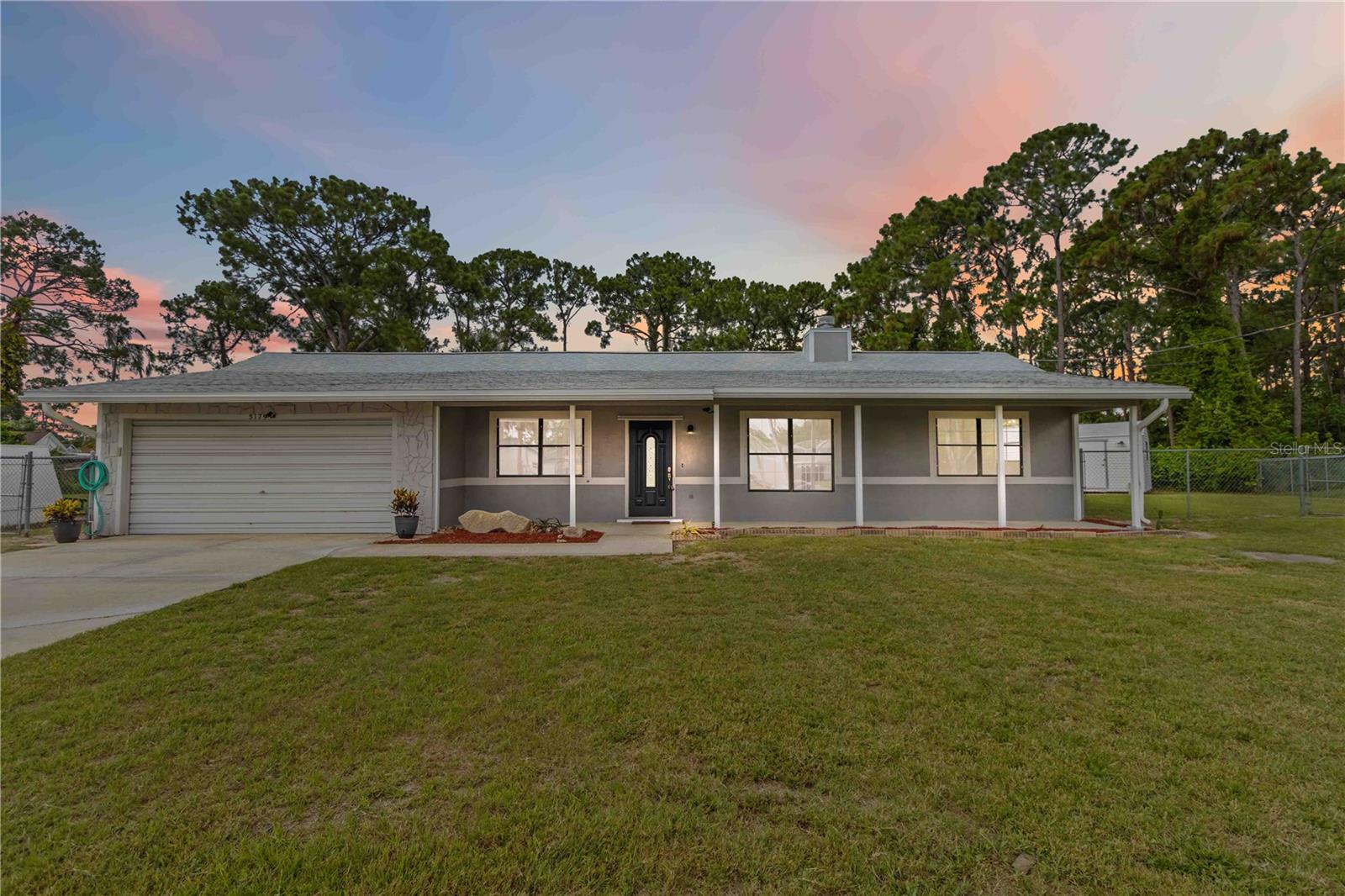 Under contract-accepting backup offers. Tucked away in a peaceful PSJ neighborhood, this move-in ready home blends comfort, function & charm on over 1/3 acre plus open space! Serene oversized backyard is ideal for entertaining w/fruit trees, an outdoor theater, plus 2 large outbuildings (1 w/electric) for those w/a passion for projects, workshop or storage. Lots of RV/boat parking plus a 600 sq ft oversized 2 car garage! Inside, an open floor plan & vaulted ceilings create a spacious & bright atmosphere, where a cozy wood-burning fireplace creates a perfect place to relax & enjoy friends & family. Kitchen equipped w/newer stainless appliances, ample cabinetry & convenient breakfast bar. Spacious family room overlooks the backyard & offers a versatile space for movie nights, office or playroom. The master suite is your private retreat, complete w/walk-in closet & ensuite bath boasting a walk-in shower & modern vanity. Just 25 min to KSC, NASA, SpaceX, Blue Origin & the beach, 40 min to Orlando airport & area attractions!