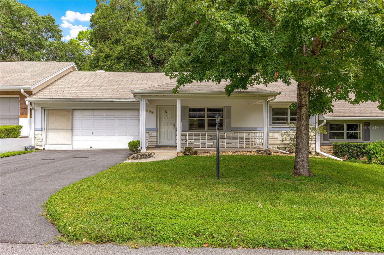 PRICED TO SELL! VERY Popular Montgomery Model Villa with 2 Bedrooms, 2 Baths, 2-Car Garage, and a FIREPLACE! Roof 2015, HVAC 2024, & water heater 2017. Notice the large, inviting front porch as you approach this move-in ready villa, perfect for enjoying your morning coffee and greeting your neighbors! The driveway has sufficient space for 2+ cars, plus the 2-car garage. Step into the foyer that buffers a direct entrance/view into the living room/dining room space. Notice the neutral laminate flooring throughout, tile in "wet" areas, and updated lighting! NO CARPET! Both bedrooms are on the right side of the home, with the guest room in front with a large/deep closet, and the hall/guest bath dividing the bedrooms. Hall bath is updated with tub and tile surround, with glass doors, and comfort height toilet. The primary bedroom is in the back right of the home for privacy. The primary bedroom includes a walk-in closet and en suite bath with step-in tiled shower with grab bars, updated vanity, and comfort height toilet. The kitchen has been nicely updated with new countertops, custom tile backsplash, brand new appliances, deep sink, and more! The family room includes a fireplace with a blower for those chilly central Florida nights! The family room is light and bright, with entrance to the garage where the laundry hookups and laundry tub are located. The finished Florida room is off the family room with lots of windows for natural light, under heat/AC! A paver patio in back is perfect for grill space, with Green space providing privacy! AND THE WHOLE HOUSE INTERCOM STILL WORKS! The monthly HOA fee includes Basic Spectrum Cable, irrigation water, roof repair, exterior painting every seven years, exterior maintenance and insurance, landscaping, trash & recycling, 24/7 monitored gates and what seems like endless amenities; three pools (2 outside & 1 inside & another under construction), two state of the art fitness centers, pickleball (uncovered & covered), billiards, archery range, corn hole, bocce ball, tennis, shuffleboard, horse shoes, remote control flying field and race cars, 175+ clubs, woodworking shop (extra fee), library, and much, much more! A golf cart community with access to several shopping centers. Centrally located 20 minutes from the World Equestrian Center, easy drive to 4 cruise ports and/or airports, and within a close proximity to entertainment complexes in Orlando.
