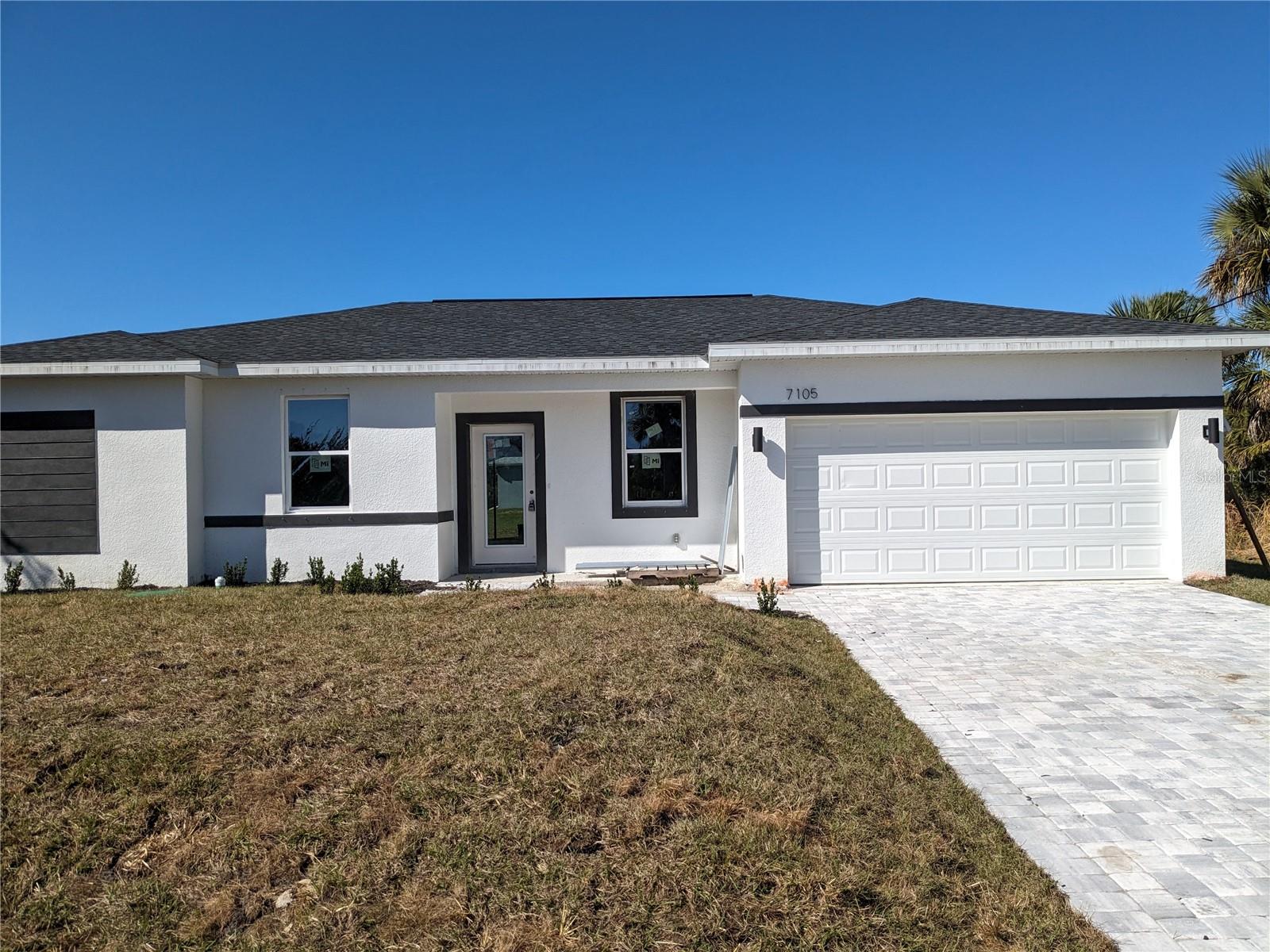 Why wait, when you can have this "2025" COMPLETELY FINISHED 4 bedroom, 2 bathroom, 2 car garage home! With over 1,600 sq.ft. of living space, this home offers the perfect blend of style, comfort, and functionality. Step inside and be greeted by a spacious and inviting open floor plan. The 9-foot ceilings create an airy and bright atmosphere, making this home a welcoming oasis for family and friends. The heart of this home is the beautiful kitchen, featuring a breakfast island, stainless steel appliances, and elegant granite countertops. It's a chef's dream, perfect for preparing meals and entertaining guests. The generously sized master bedroom is a true retreat, complete with an oversized walk-in closet, ensuring you have all the space you need for your wardrobe. The master bathroom is equally impressive with dual sinks, a tiled roman shower, and a wooden vanity with a stunning granite countertop, creating a luxurious spa-like experience right at home. The guest bathroom offers a tiled shower and tub combination, making it versatile and convenient for both residents and visitors. This home also includes an inside utility room for your laundry needs, making chores a breeze. You'll love the easy-to-maintain wood vinyl flooring that flows throughout the home, adding a touch of warmth and elegance. This incredible home will be ready for you in just one month, and it's perfectly located in Port Charlotte. You'll be close to schools, shopping centers, and an array of restaurants, ensuring that your daily needs are always within reach. Don't miss out on this amazing opportunity to make this new construction your forever home. Call today to schedule a private tour!