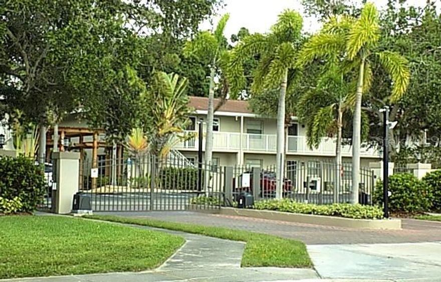 Spacious 2-bedroom, 1-bath condo with 865 sq ft located on the second floor, featuring ceramic tile flooring in the main living areas and an open floorplan with a formal dining area. The updated kitchen and bathroom boast elegant granite countertops. Enjoy relaxing on the screened balcony, which overlooks a peaceful, shaded courtyard and the community pool. Situated in a gated community offering amenities such as a fitness center, clubhouse, and a large pool. Conveniently located near downtown Sarasota and SRQ Airport.