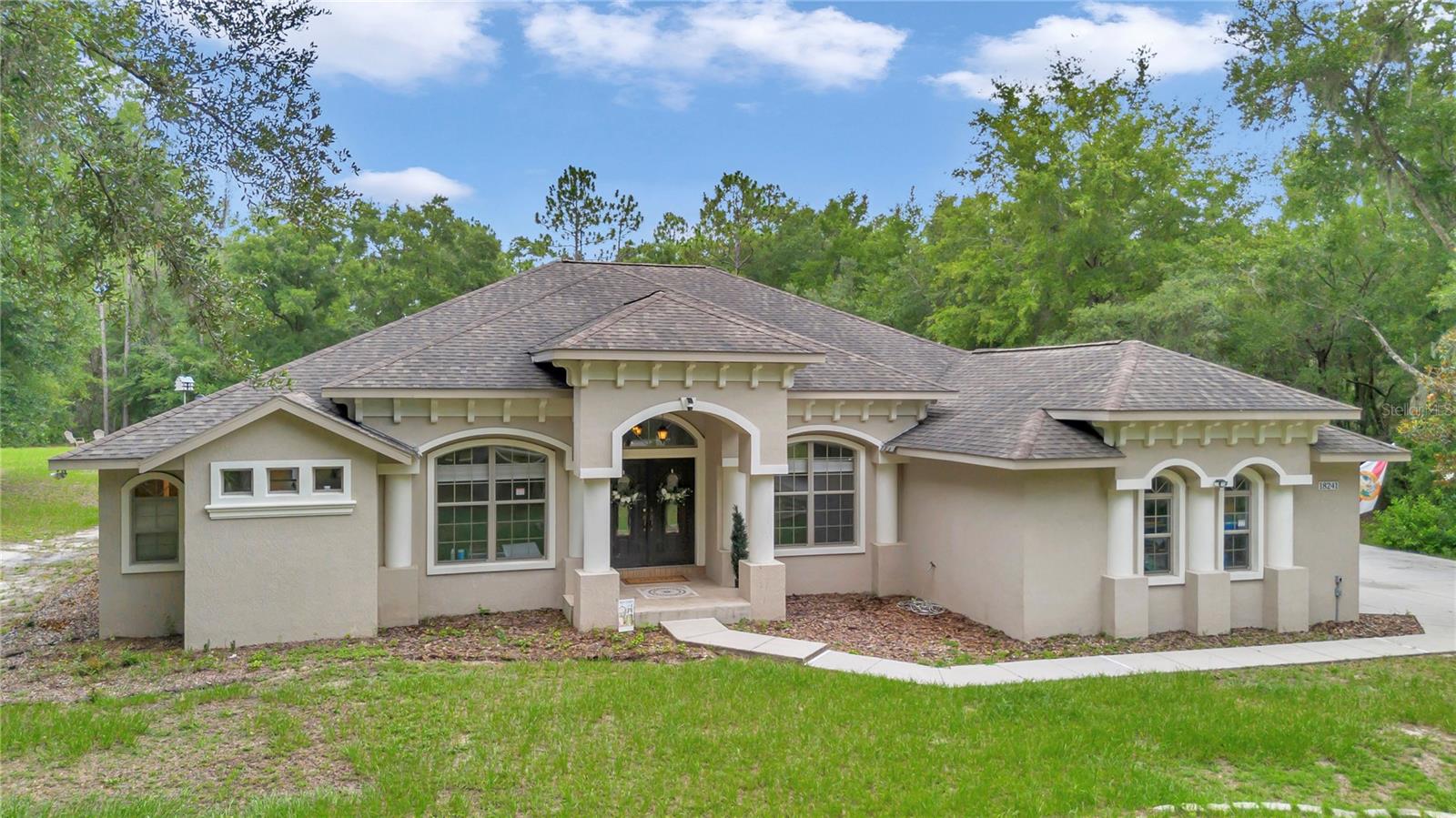 Welcome Home to The Forest at Rainbow Springs. Incomparable attention to detail and presentation elevates this 2601 sf concrete block construction 3 bedroom 2 bath with bonus 4th bedroom/office/in-law suite, 2-car garage pool home above ALL competition. Stunning in-ground concrete-finished pool and spa with brand new salt water system and huge screened enclosure, Fresh interior and exterior paint and brand new luxury vinyl plank flooring in all bedrooms, dual AC units, and tankless hot water heater on 1.44 acres. The spacious entry invites you to relax under high ceilings with a wide open floor plan that provides an exceptional venue for gathering. A true split layout, you'll find the huge primary suite with his and hers walk in closets and en suite bath a truly private retreat The kitchen is a chef's dream with an abundance of cabinetry, stainless steel appliances, granite countertops, and corner pantry. As you explore The Forest, the tranquility, peace, privacy, and pride in presence that distinguishes this community from all others, fills the soul with a sense of calm. Surrounded by nearly 1,600 acres of State Park land, you'll find cordial neighbors walking their dogs along the well-maintained wooded lots, and wild deer roaming among the trees. Experience old Florida at Rainbow Springs State Park a few minutes down the road with miles of walking trails that follow the river. World renowned Rainbow Springs is 6 miles of clear spring fed water in Marion County, Florida with a constant temperature of a refreshing 71 degrees year round. The Rainbow Springs Property Association provides exclusive Rainbow River Access, with pavilions that can be rented for outdoor gatherings, a beautiful private beach, and clear waters for floating on your inner tube, or paddle boarding down the river to Swampy’s Bar & Grill on the Rainbow River. The Association also provides fitness facilities, community center and community Pool. You'll always find a match on the tennis courts and pickleball courts. Favorable rentability in this unincorporated location and just minutes to Rainbow River, the World Equestrian Center, Downtown Ocala, I-75, and Downtown Dunnellon, where you’ll find all your shopping needs. This property has easy access to Crystal River, Silver Springs, as well as Gainesville, Orlando and Tampa/Saint Pete, a perfect getaway for owners needing flexibility. Marion county continues to be an in-demand location for furnished and unfurnished rentals, making this location and property a perfect investment, or place-holder to lock in while you wait to make your Florida dream a reality! Experience all the life this home and The Forest at Rainbow Springs has to offer.