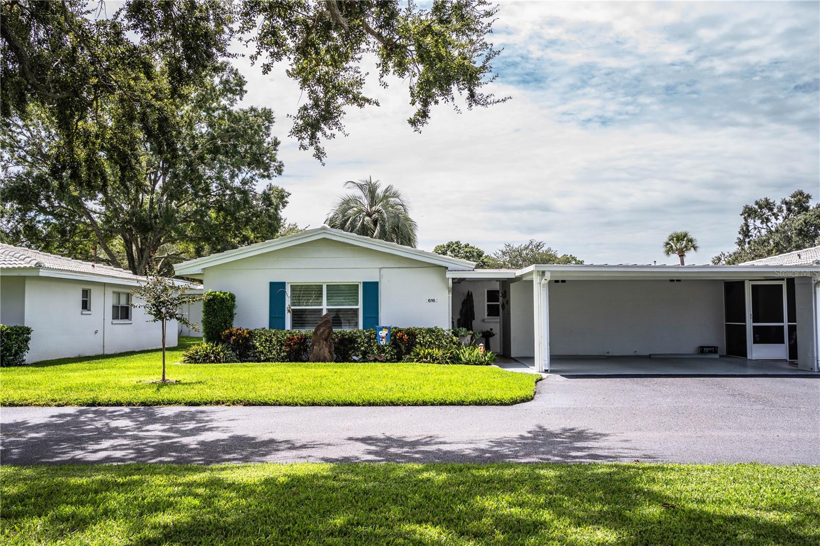 SOUTHSIDE MOVE IN READY VILLA! Don’t miss this immaculate 2BR/2Bath open floor plan condo in “The Villas”. This sought after 55+ unit is in turnkey condition with many upgrades. The updated kitchen with new farmhouse style sink, appliances (8 yrs +/-, inset lighting, wood cabinets, pantry and granite counters with archway opening to formal dining room. From the freshly painted orange peel ceiling and walls (no popcorn), plantation shutters and crown molding, to the beautiful luxury vinyl flooring (no carpet) with custom baseboards, it has been renovated from top to bottom. Plus, both bathrooms have new vanity, mirrors, lighting and toilets. Front and side patios, gutters and a covered walkway with pavers leading to an attractive front door. This is maintenance free living! Plus, a raised landscape border around the front flower bed. Separate laundry room has washer/dryer hookup, an automatic exhaust fan and extra storage space. Don’t miss this outstanding home with newer tile roof (2023) and view of tree shaded park area. Close to everything! Kelly Recreation Center, Walmart, Polk Parkway with easy access to I-4, and Lakeside Village. Call me today! Don’t wait to see this exceptional value!