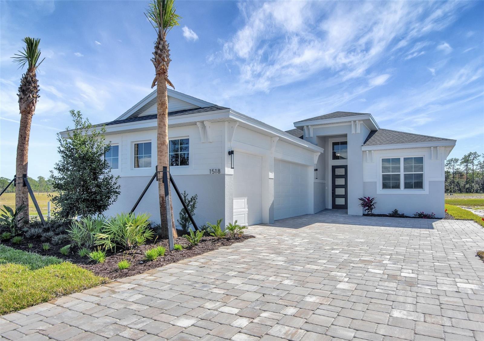 ***NEW CONSTRUCTION***Stunning 4-bedroom, 3-bath home with a 3-car garage, set on a desirable water-backed homesite. This open-concept design showcases a spacious family room and a gourmet kitchen featuring a slide-in range with integrated griddle, luxury 3cm veined quartz countertops, herringbone tile backsplash, upgraded cabinetry with crown molding, pot-and-pan storage drawers, and a 24” deep cabinet above the refrigerator with side panels.
The Owner’s Suite offers laminate wood plank flooring and a spa-like bath with frameless shower enclosure, quartz countertops, and tile-to-ceiling in the shower. All baths feature frameless glass and floor-to-ceiling tile, creating a sleek, modern finish. Designer details include a glass front door, and washable flat interior paint for style and easy care.
With its blend of luxury design selections, functional storage, and a prime coastal-inspired location, this home delivers both elegance and everyday comfort.