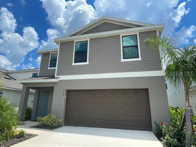 Welcome to Skye Ranch, a highly sought-after gated community with incredible amenities. This 2024-built home offers 4 bedrooms, 2.5 bathrooms, and a versatile loft. On the main level, the open-concept layout connects the family room, dining area, and kitchen, creating a bright and welcoming space. The modern kitchen features an oversized island, quartz countertops, and stainless-steel appliances. Step outside to a spacious backyard with a large retractable electric awning—perfect for enjoying the outdoors in comfort. A two-car garage with an electric vehicle outlet for added convenience.
Upstairs, you’ll find the loft, ideal for a home office or playroom. The primary suite includes an en-suite bathroom with a double vanity, walk-in closet, and plenty of space to unwind. Three additional bedrooms, a full bathroom, and a laundry room complete the second floor.
The amenities here truly set Skye Ranch apart. The Hub offers an indoor basketball court, pickleball courts, fitness center, climbing wall, café, and private event rooms available for reservation. Outdoors, enjoy a resort-style pool with splash pad, hot tub, and a second lap pool, all surrounded by preserved natural beauty. Miles of scenic trails wind through lush palms and forested wetlands, making this community feel like a retreat.